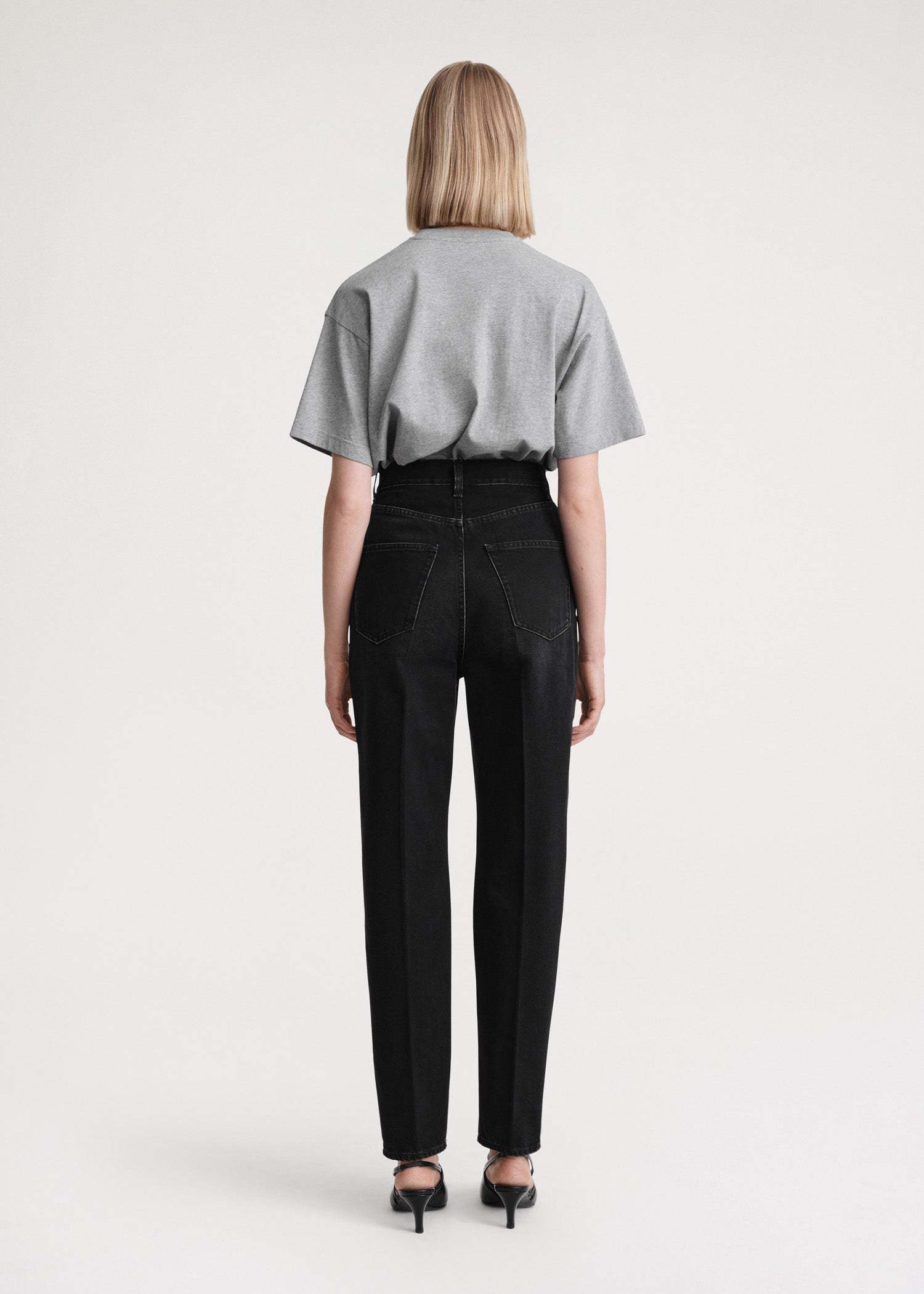 Totême Faded-effect Tapered-leg Jeans In Black