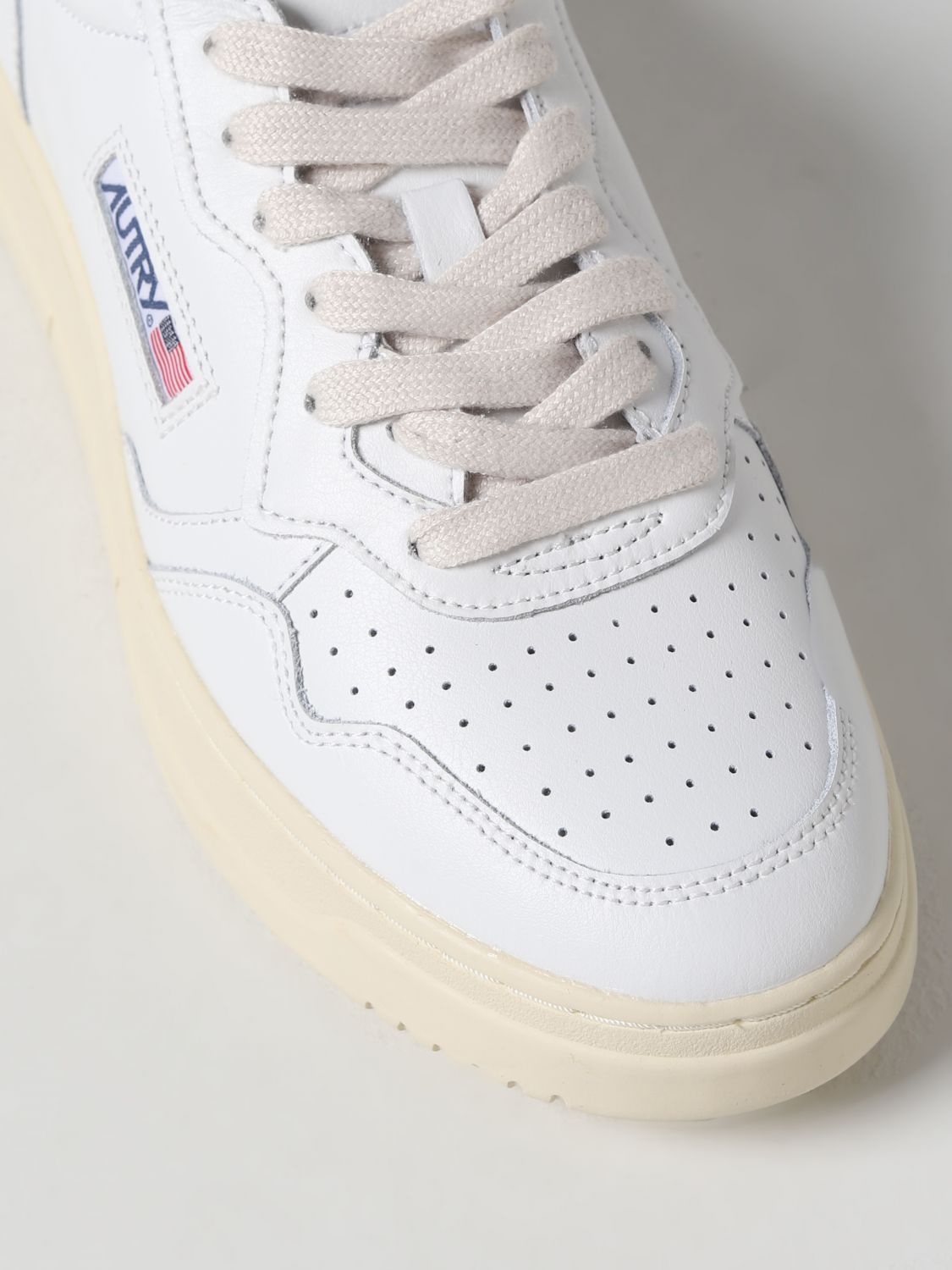 Shop Autry Logo-patch Lace-up Sneakers In White