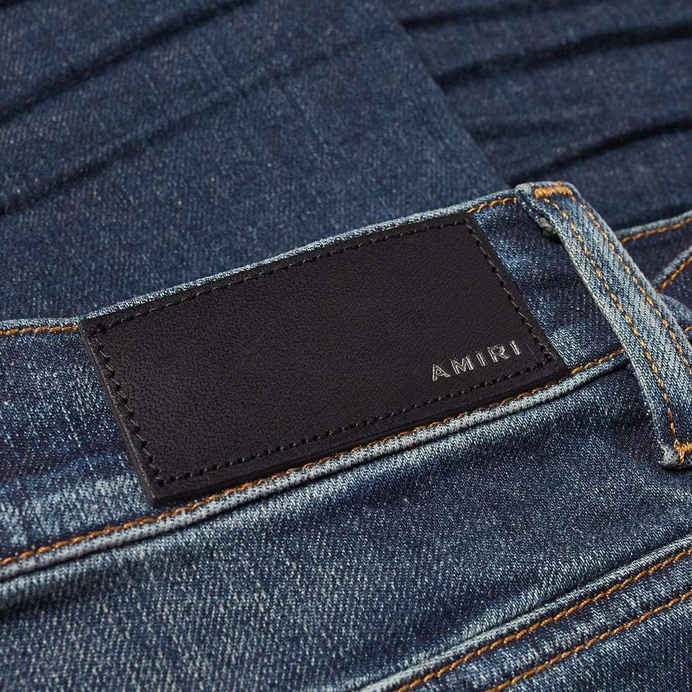 AMIRI RIPPED-DETAIL STRAIGHT-LEG JEANS