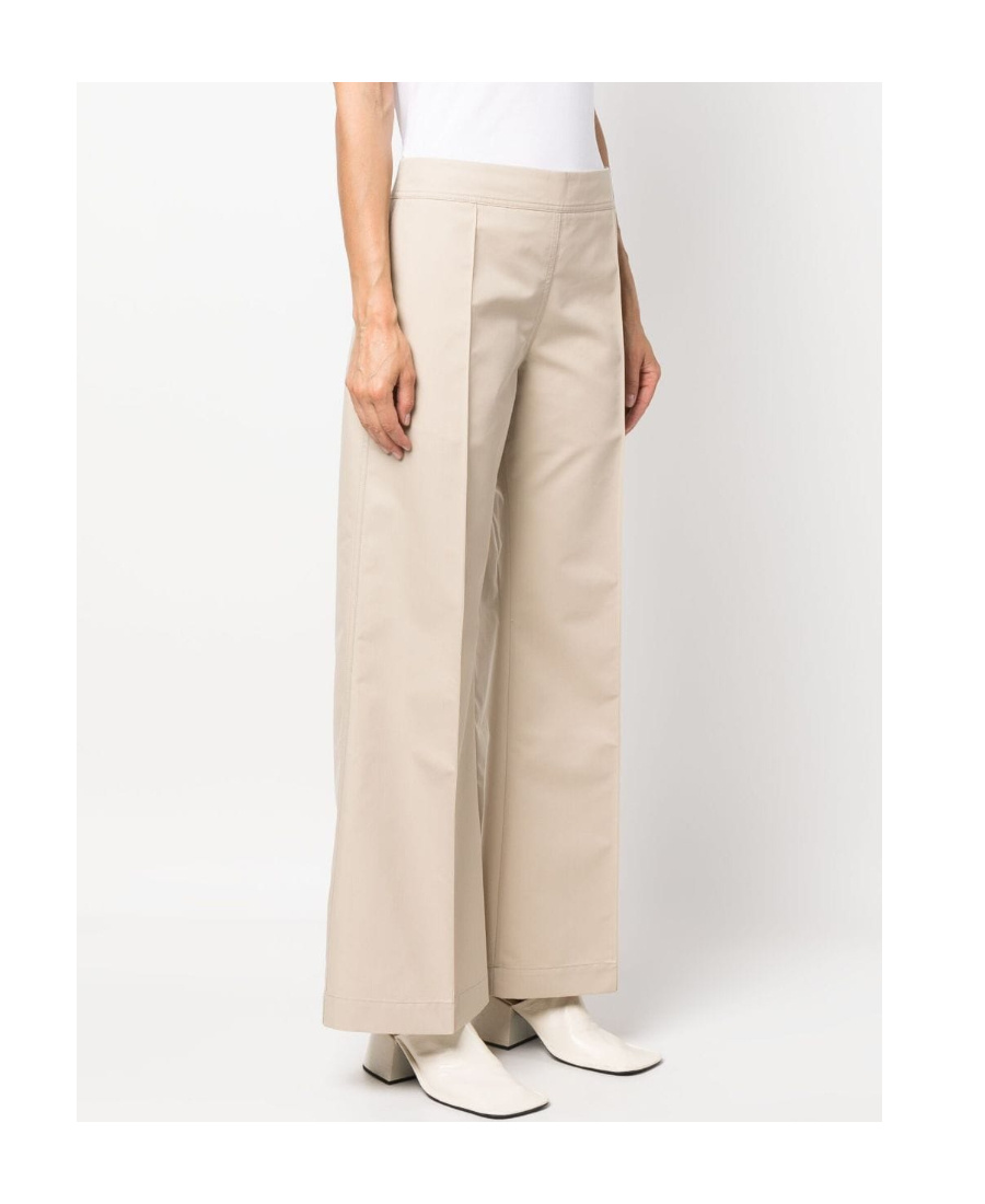 Studio Nicholson Acapulco Flared Trousers In Nude