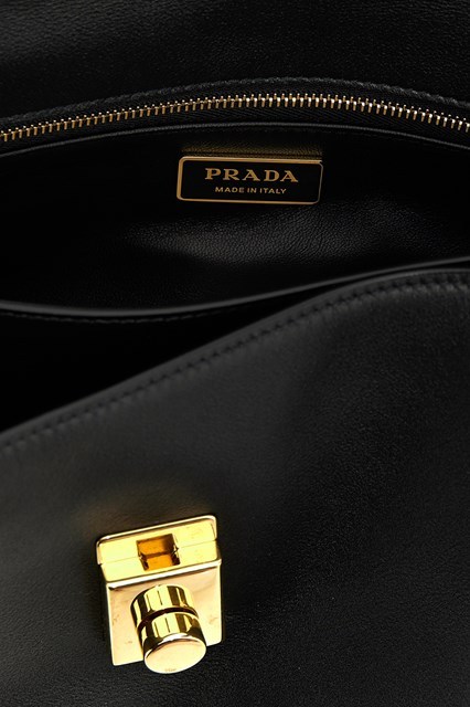 Prada Flip Shoulder Bag In Black