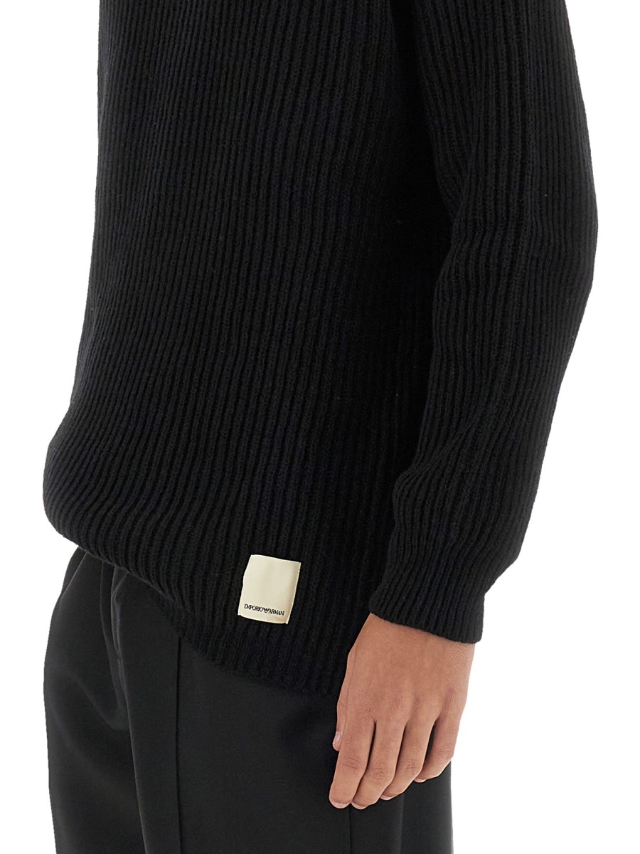 Shop Emporio Armani Long-sleeved Ribbed Sweater In Black