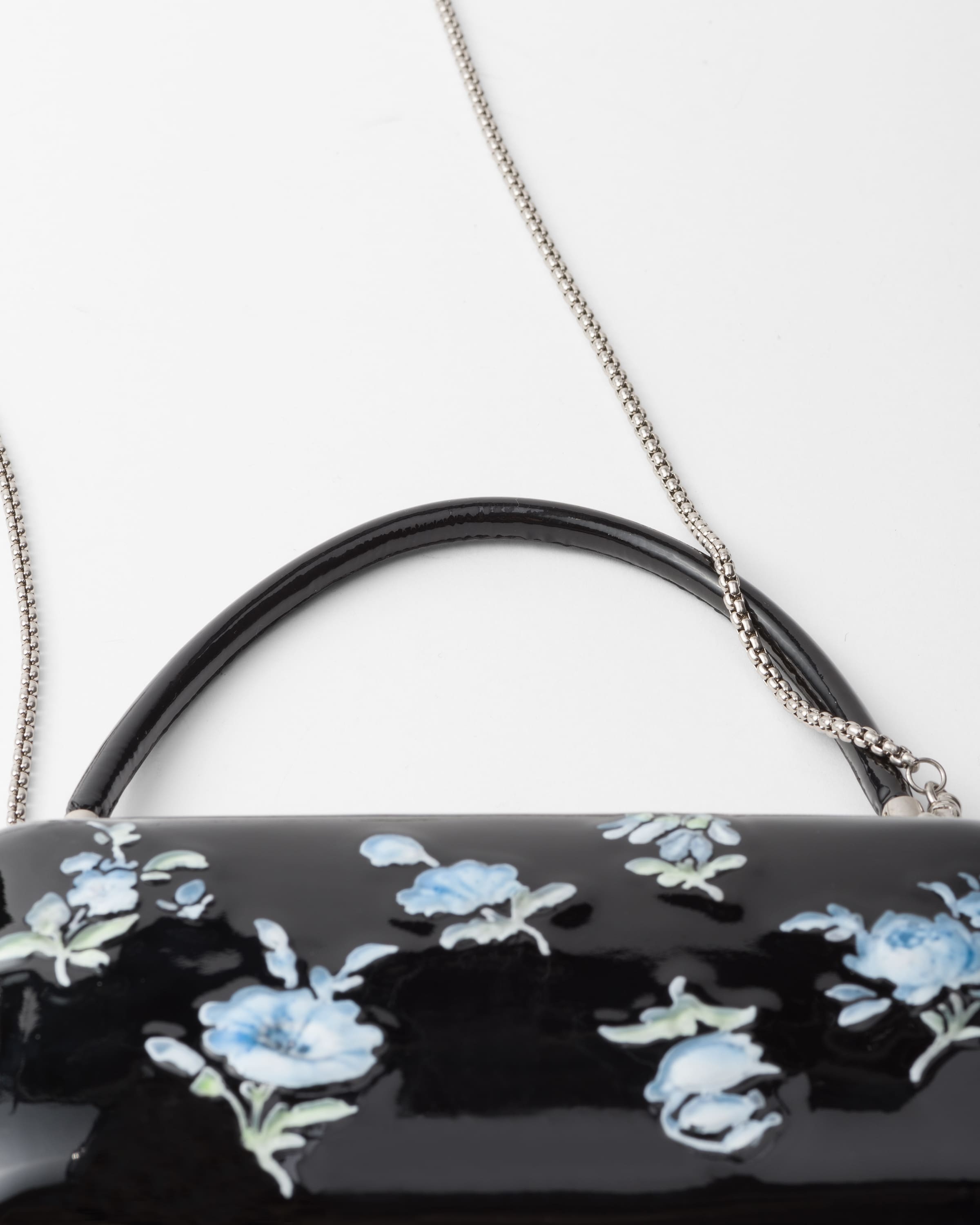 Prada Floral-printed Patent Leather Clutch In Black