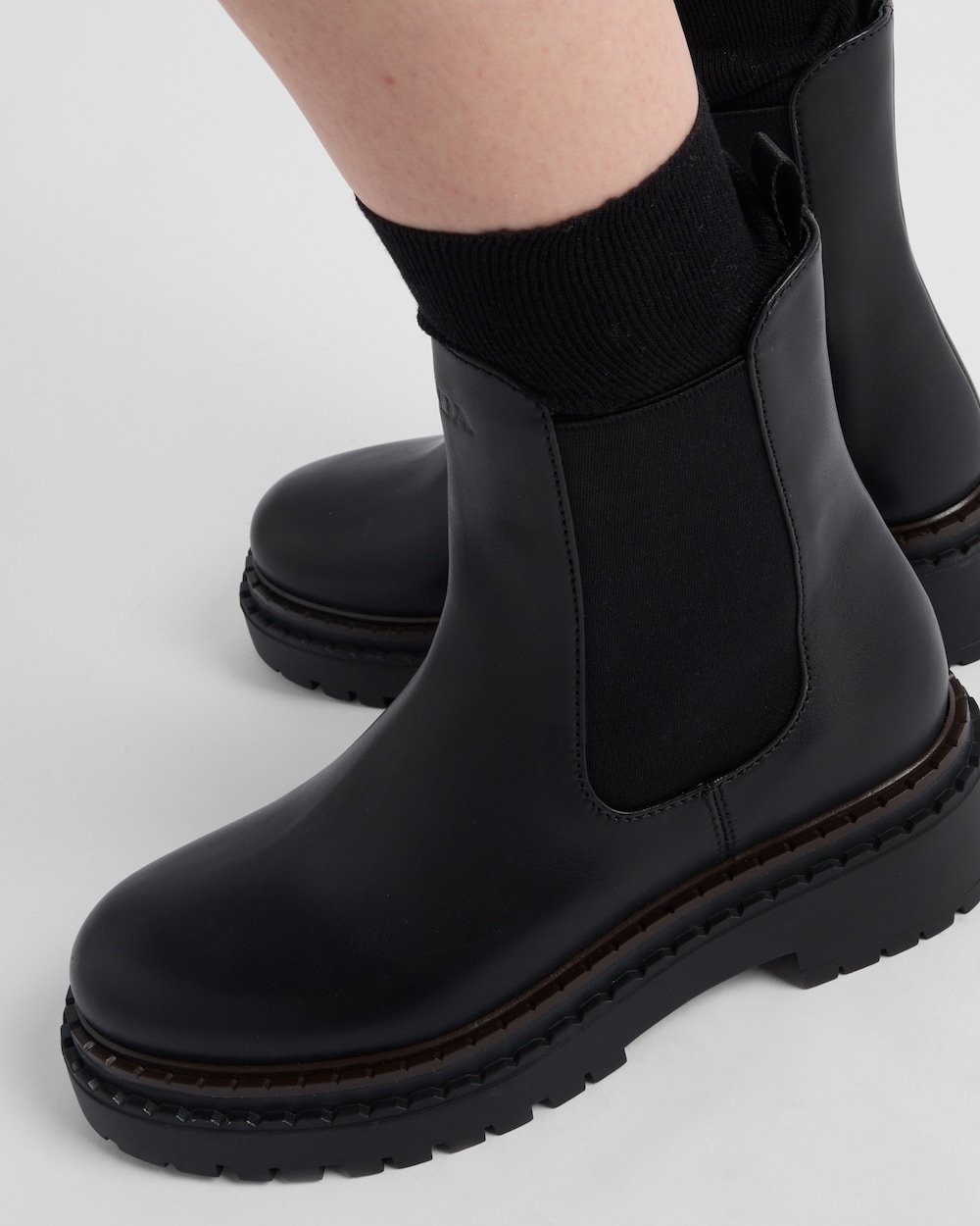 Prada Logo Details Chelsea Boots In Black