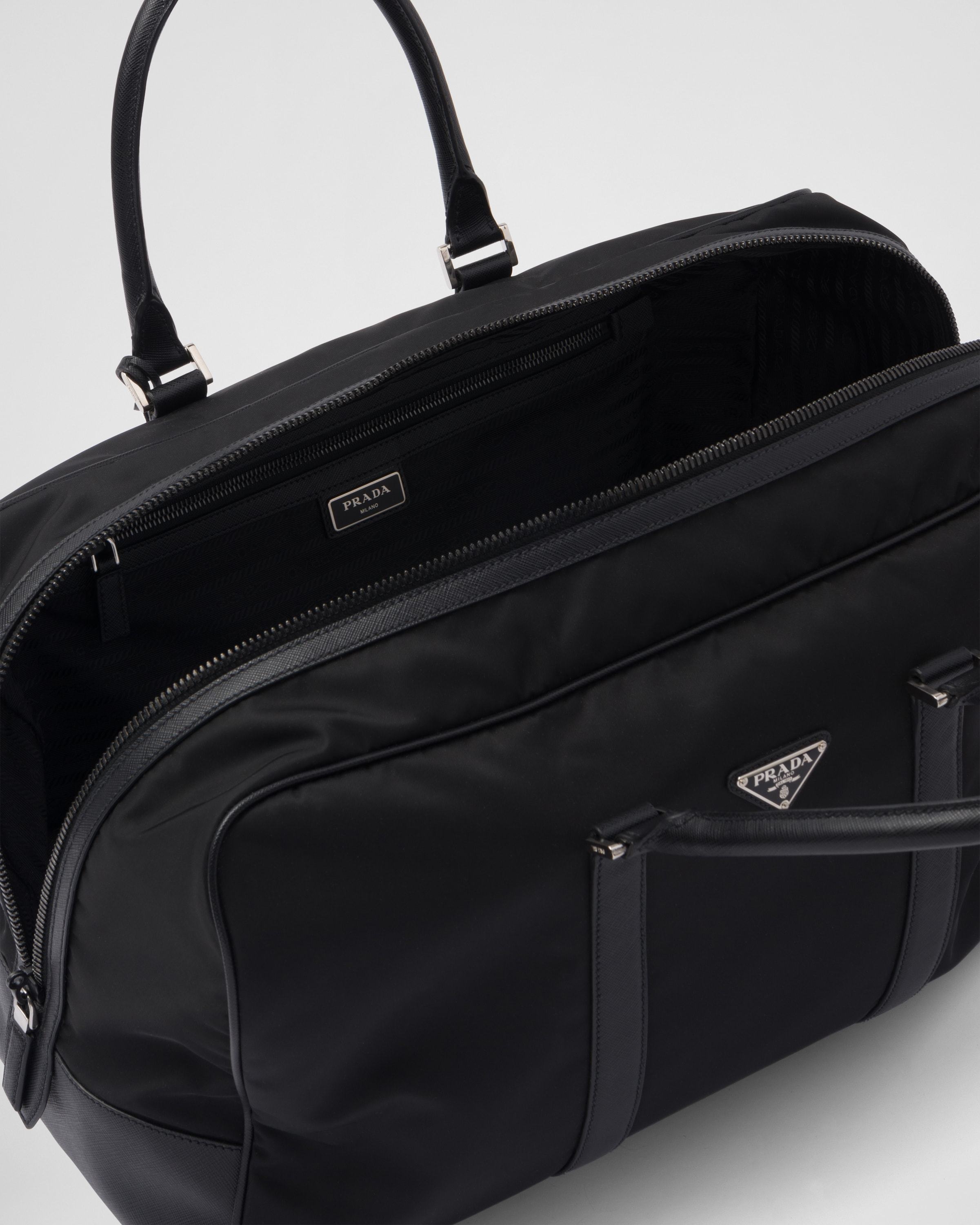 Prada Triangle-logo Zipped Tote Bag In Black