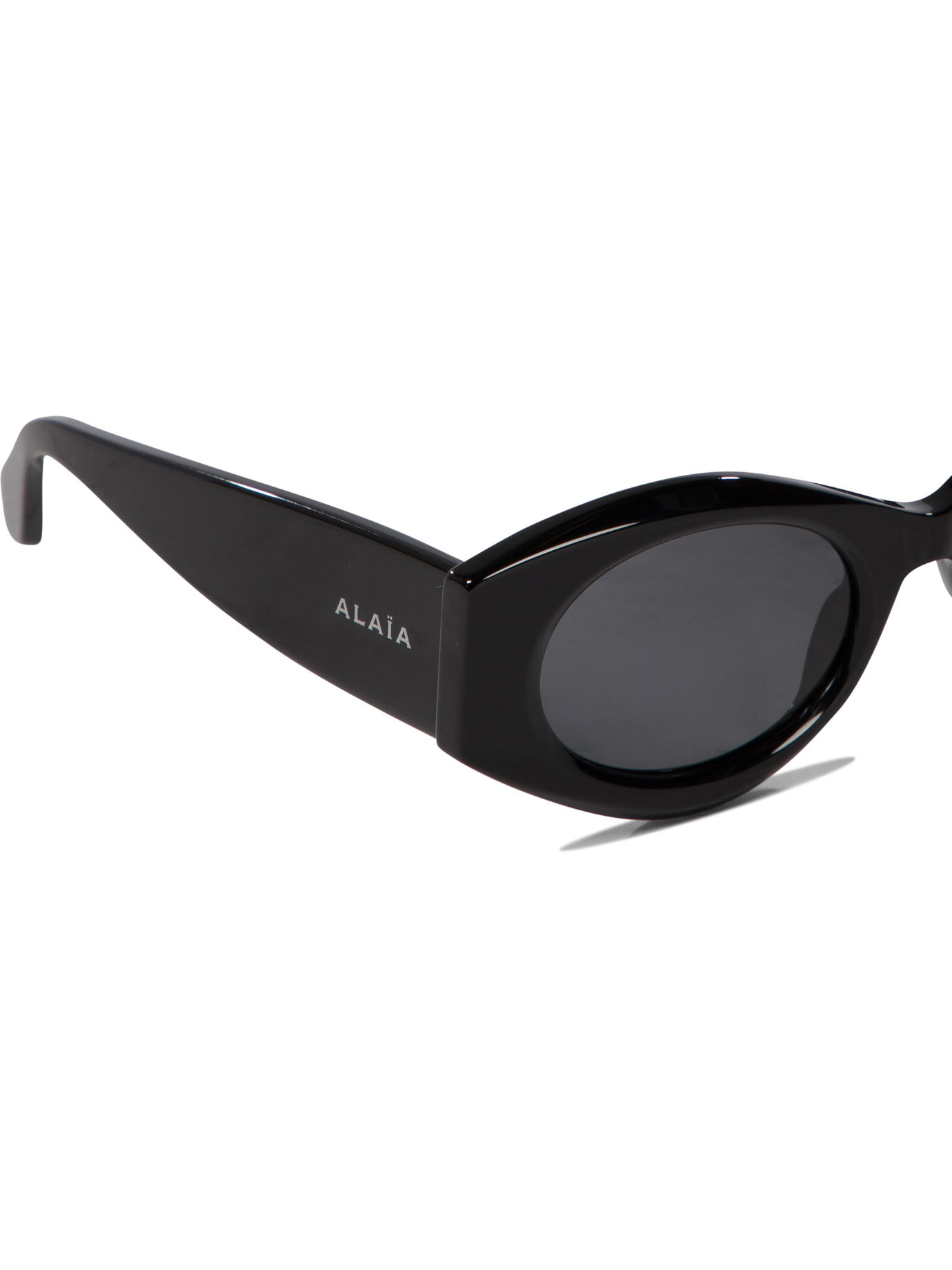 Shop Alaïa Oval-frame Sunglasses In Black