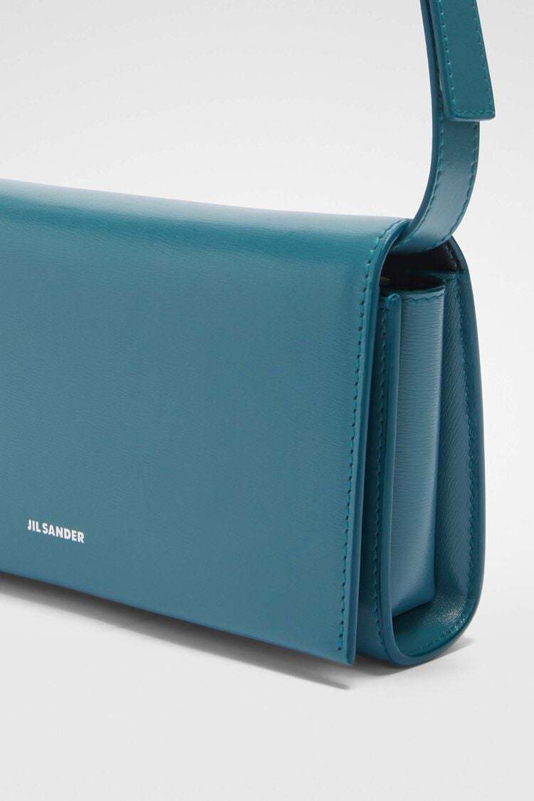 Jil Sander All-day Logo Embossed Small Crossbody Bag In Blue