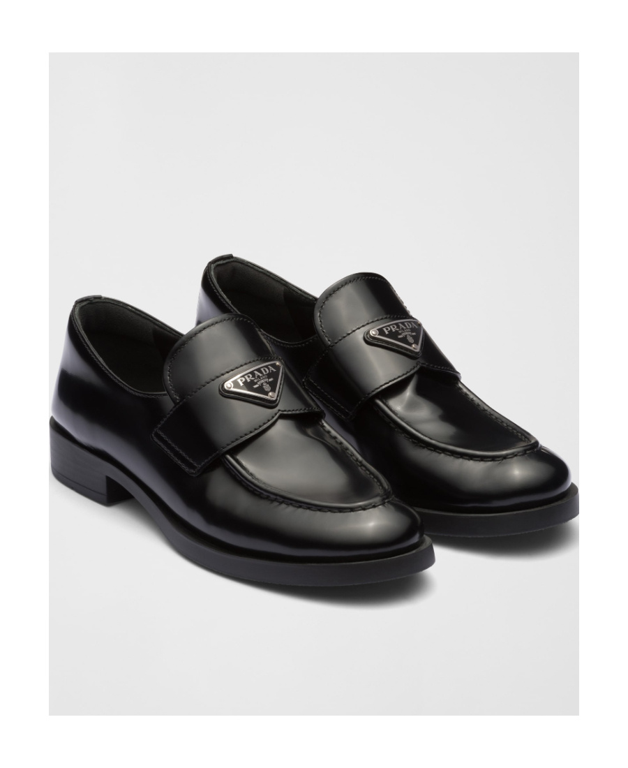 Prada Logo Plaque Almond-toe Loafers In Black