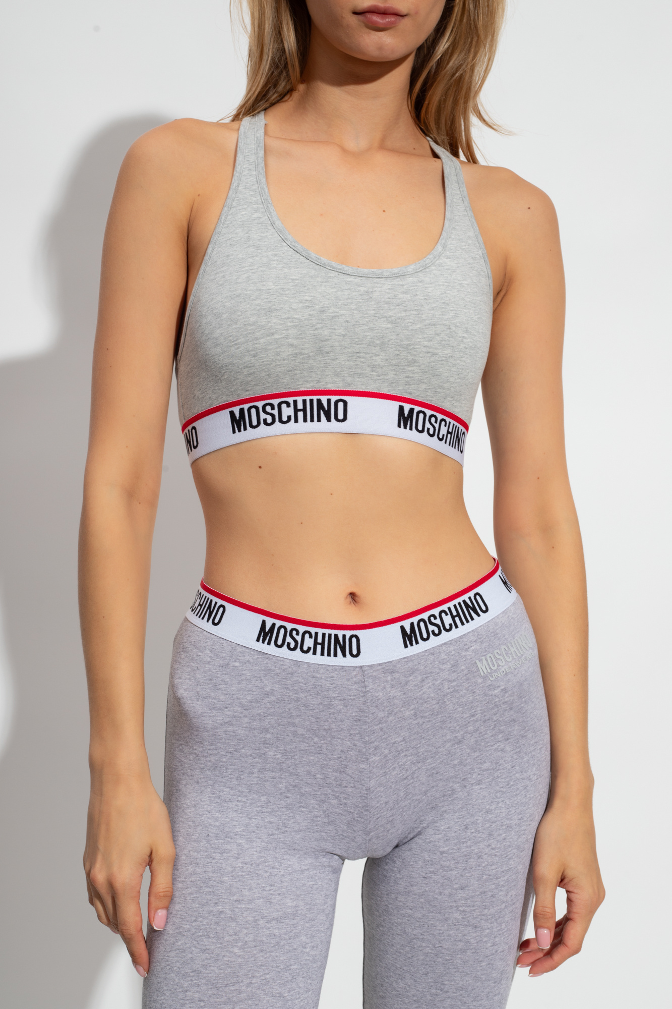 Shop Moschino Logo Underband Sports Bra In Gray