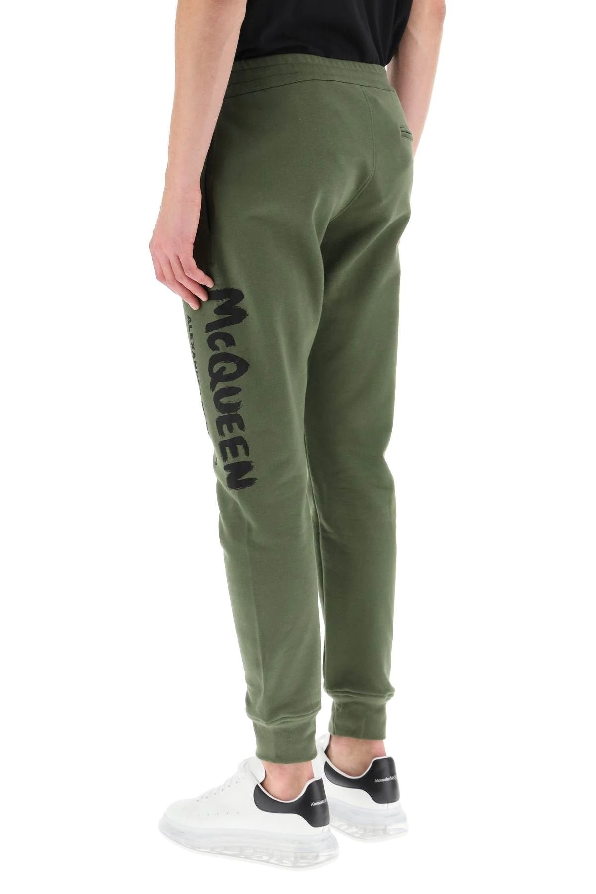 Alexander Mcqueen Logo Print Tapered Track Trousers In Green