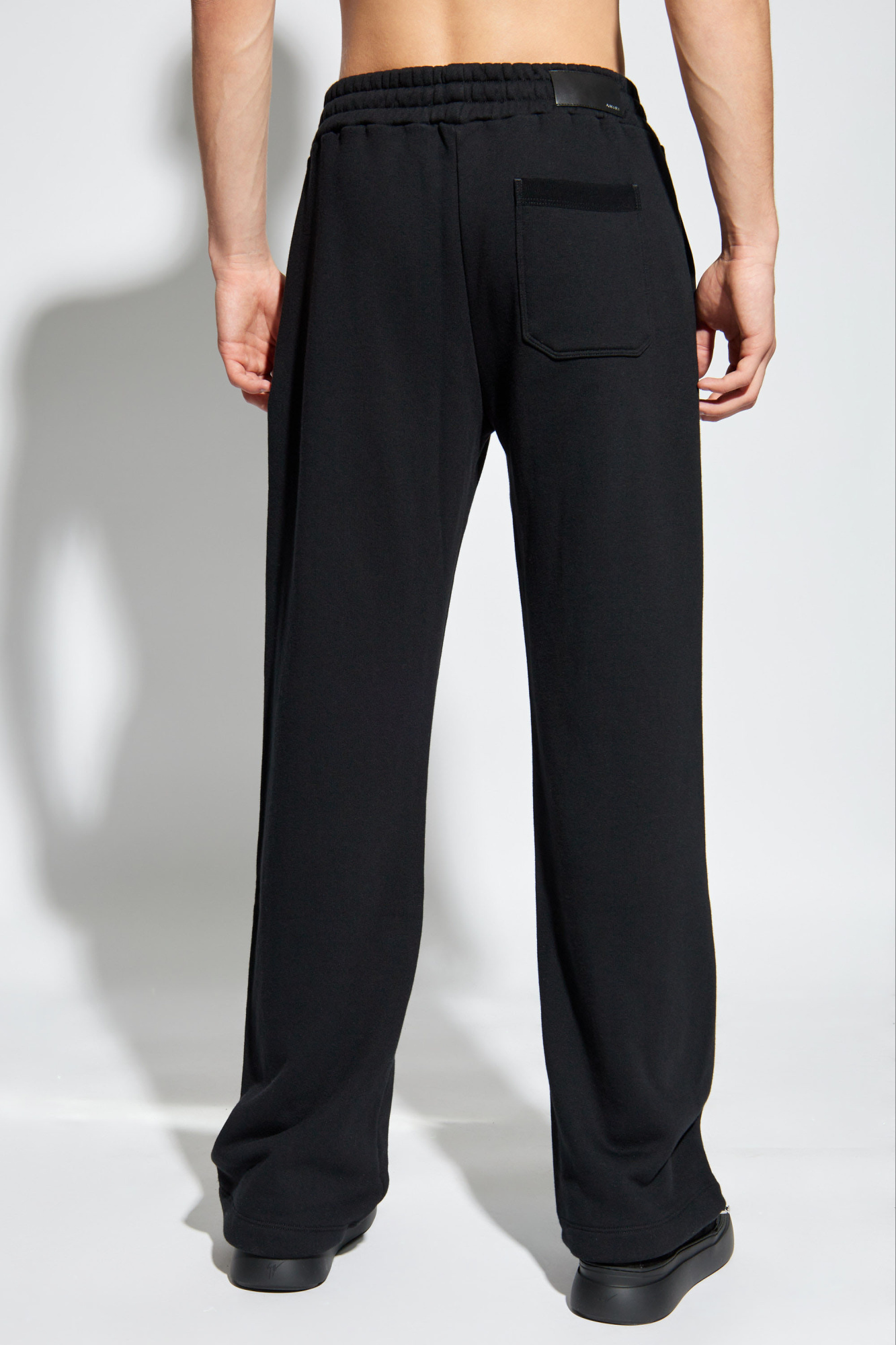 Amiri Logo Printed Drawstring Sweatpants In Black