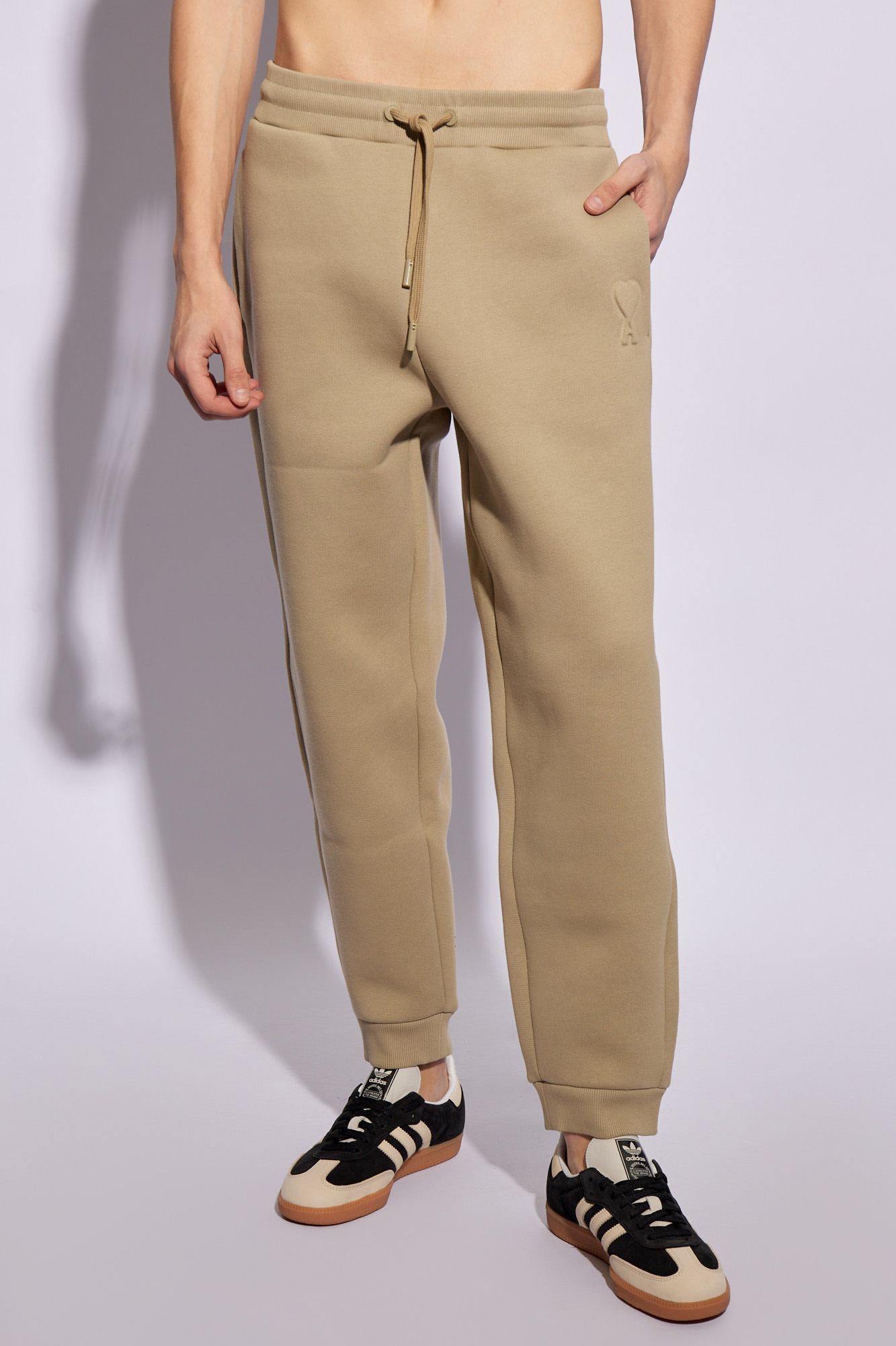 Shop Ami Alexandre Mattiussi Ami Logo Embossed Drawstring Track Pants In Nude