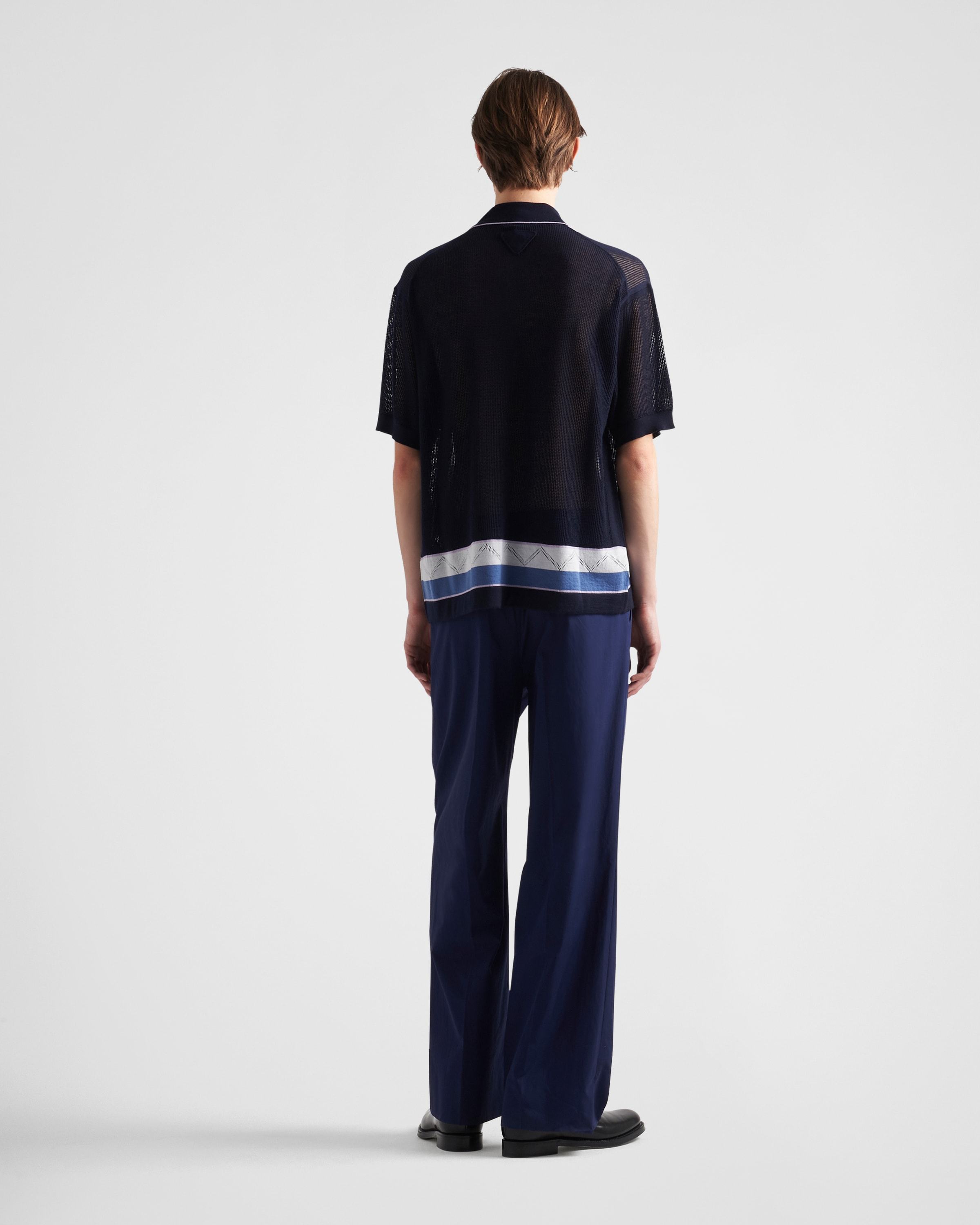 Prada Enamel Triangle-logo Trousers In Black