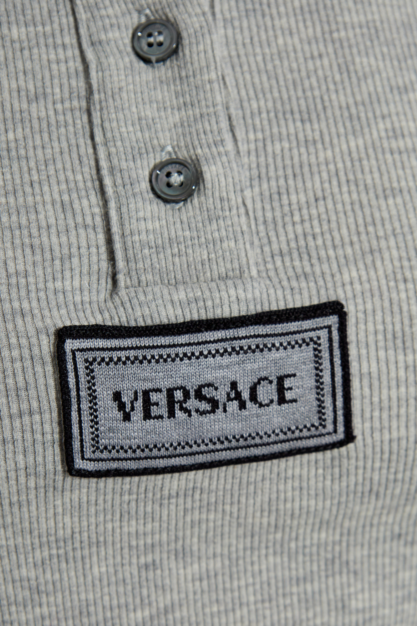 Versace Logo Tag Long-sleeved Ribbed Top In Gray