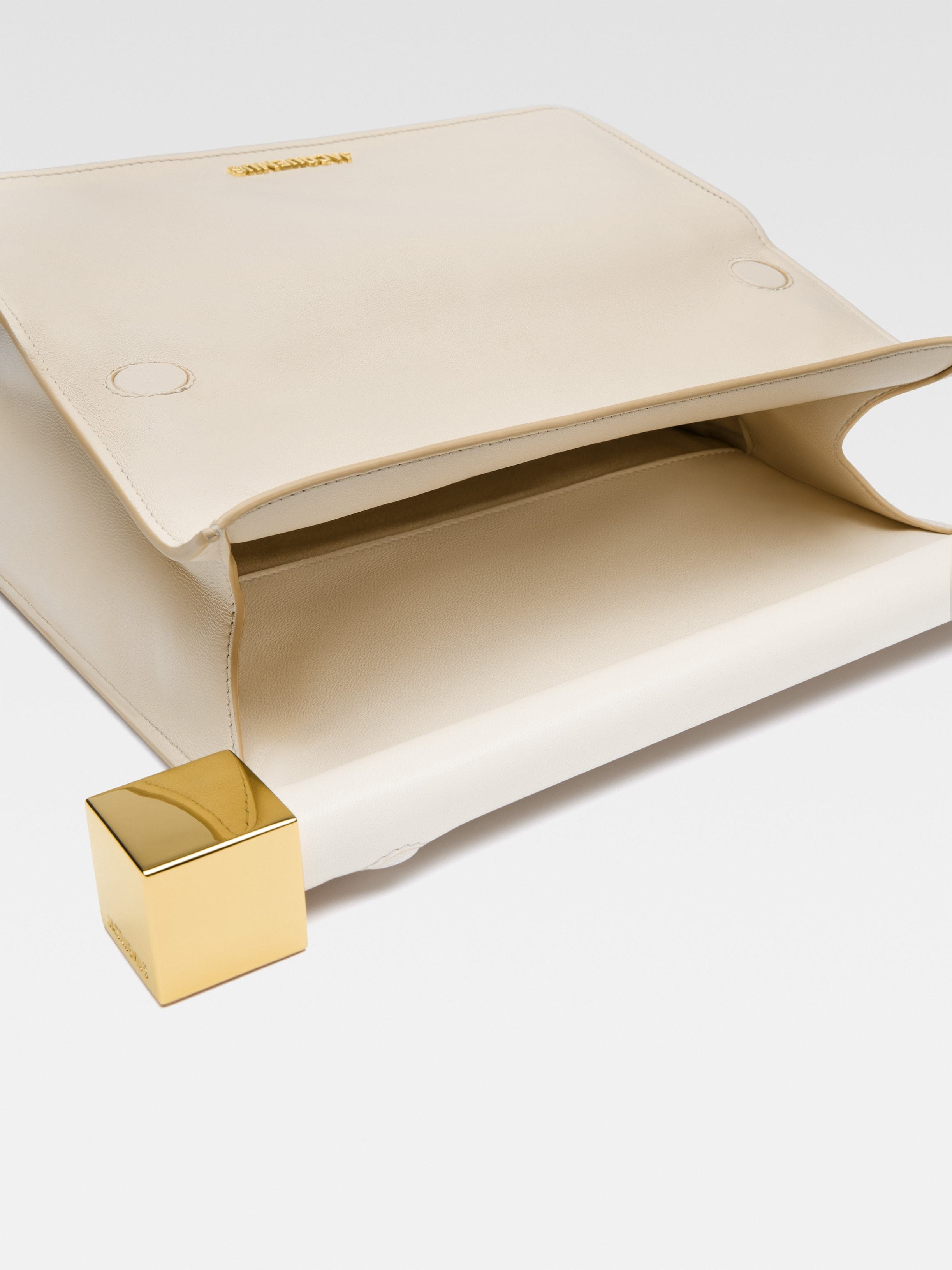 Jacquemus Ivory Leather Clutch Bag With Logo Plaque And Gold Details