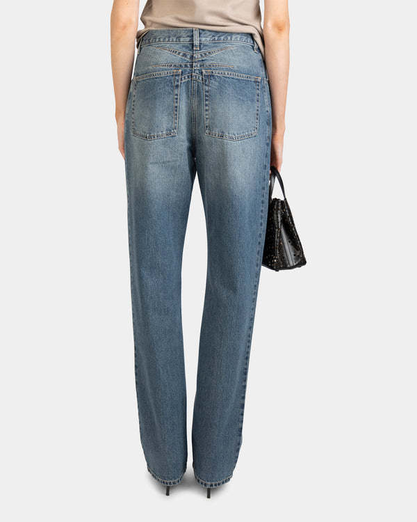 ALAÏA MULTI-POCKET DENIM TROUSERS