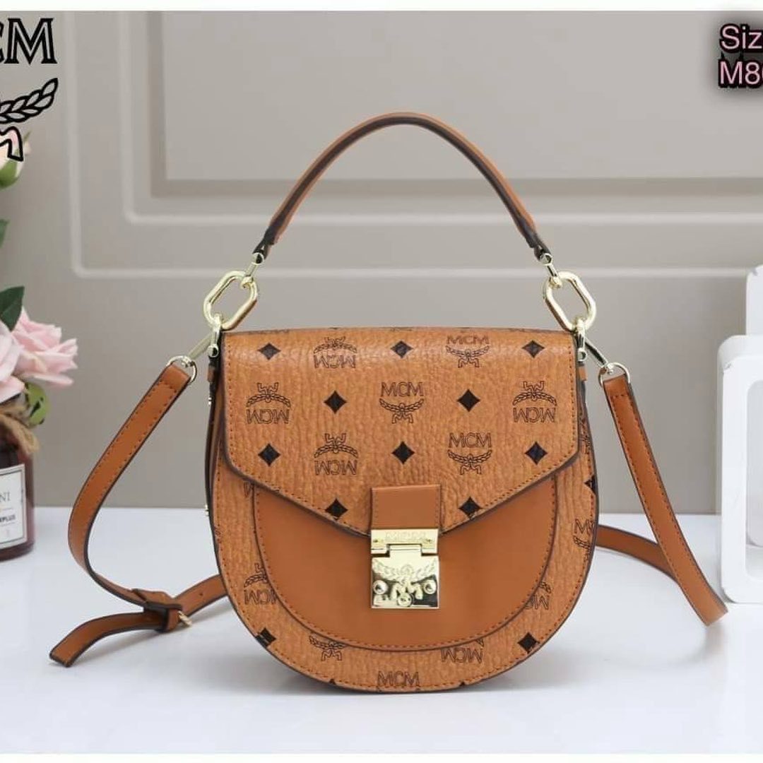 Mcm Printed Logo Handbag In Brown