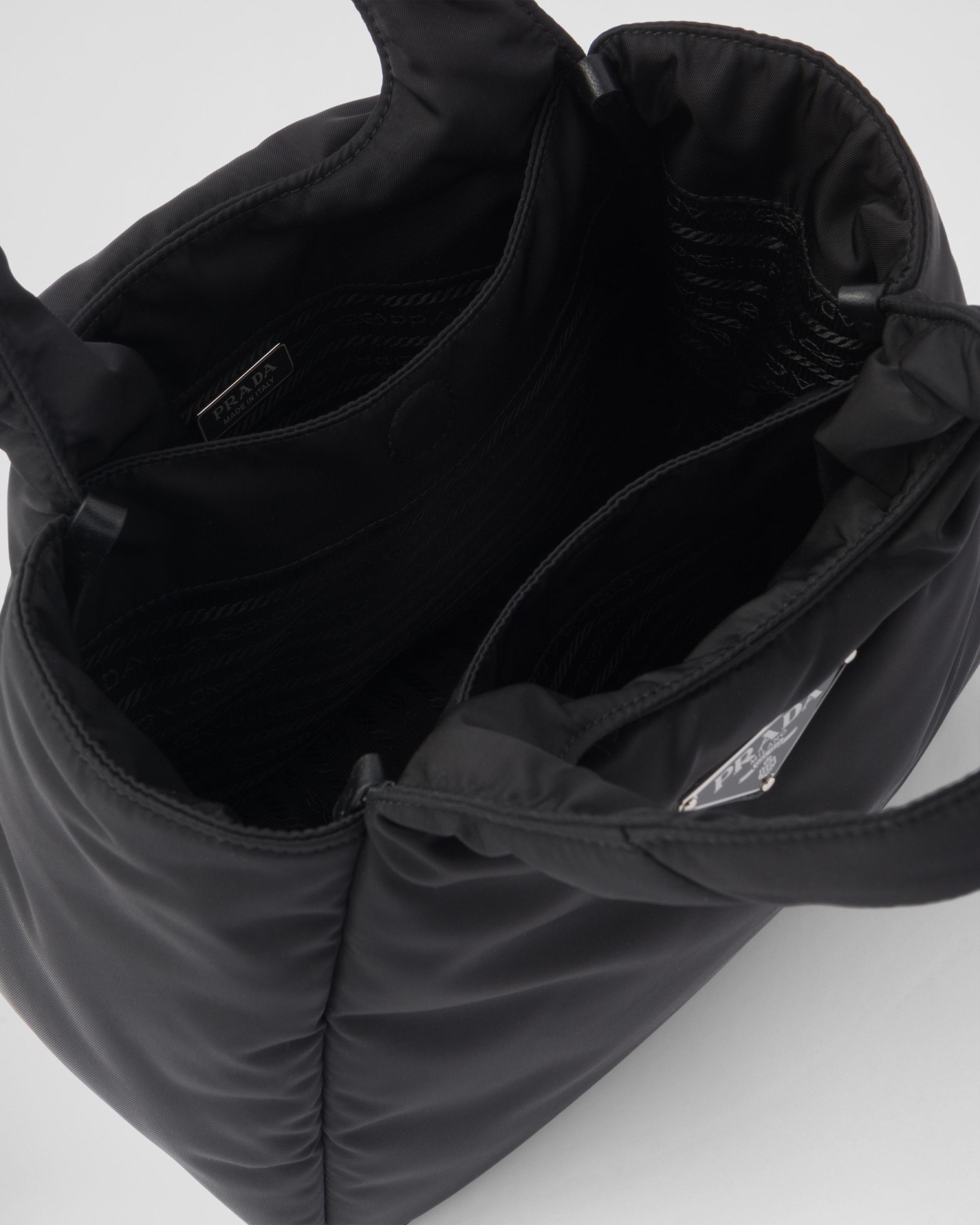 Prada Logo Plaque Padded Mini Tote Bag In Black