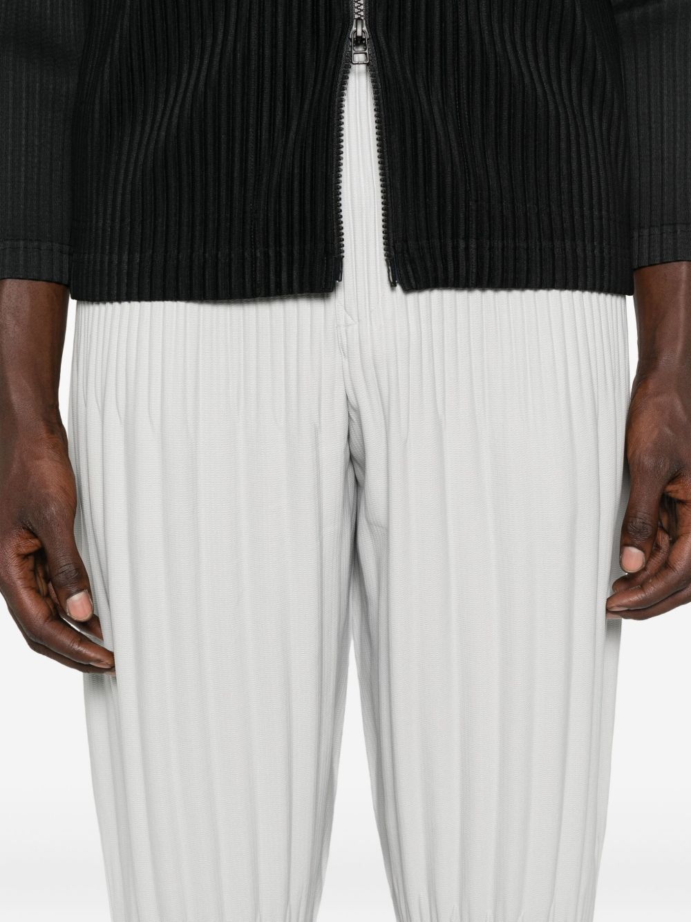 Issey Miyake Basic Pleated Tapered-leg Knitted Trousers In Gray