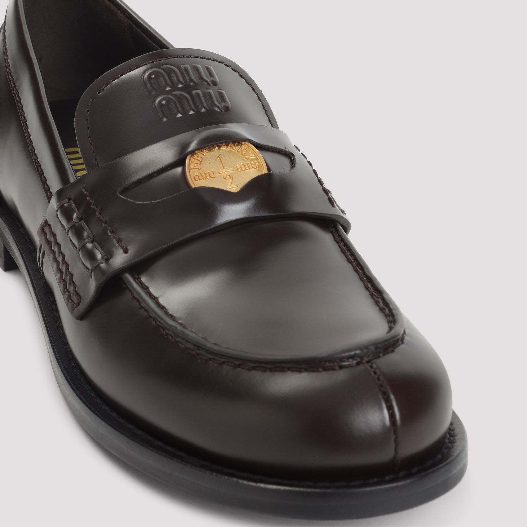 Miu Miu Logo Embossed Leather Loafers In Black