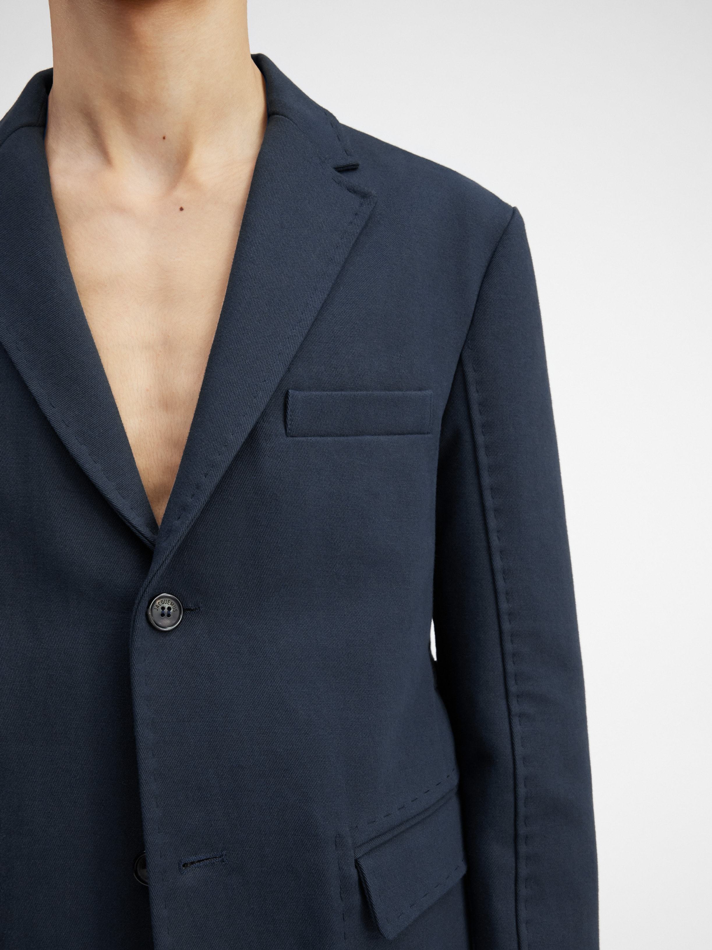 Jacquemus La Veste Piccinni Belted Jacket Featuring Notch Lapels In Black