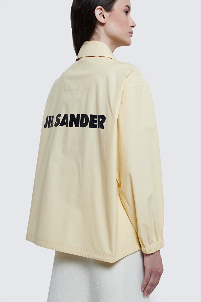 Jil Sander "coach Jacket With Logo Print" In Yellow