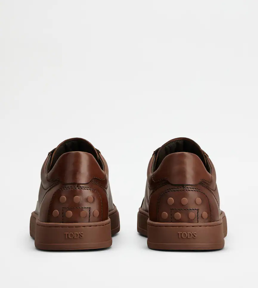 Tod's Allacciata Cassetta Rubber-trimmed Glossed-leather Sneakers In Brown