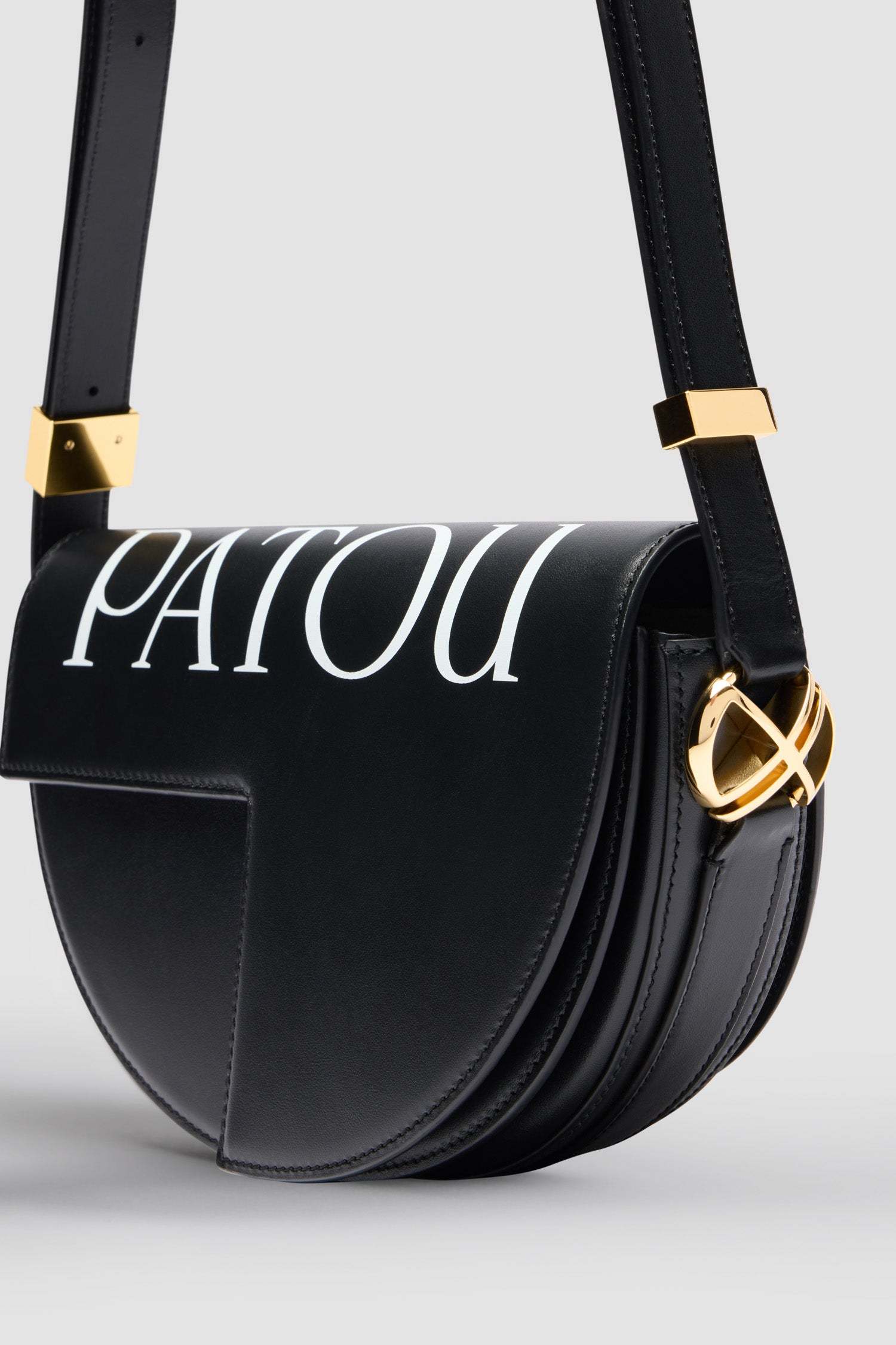 Patou Logo Print Fold-over Top Shoulder Bag In Black