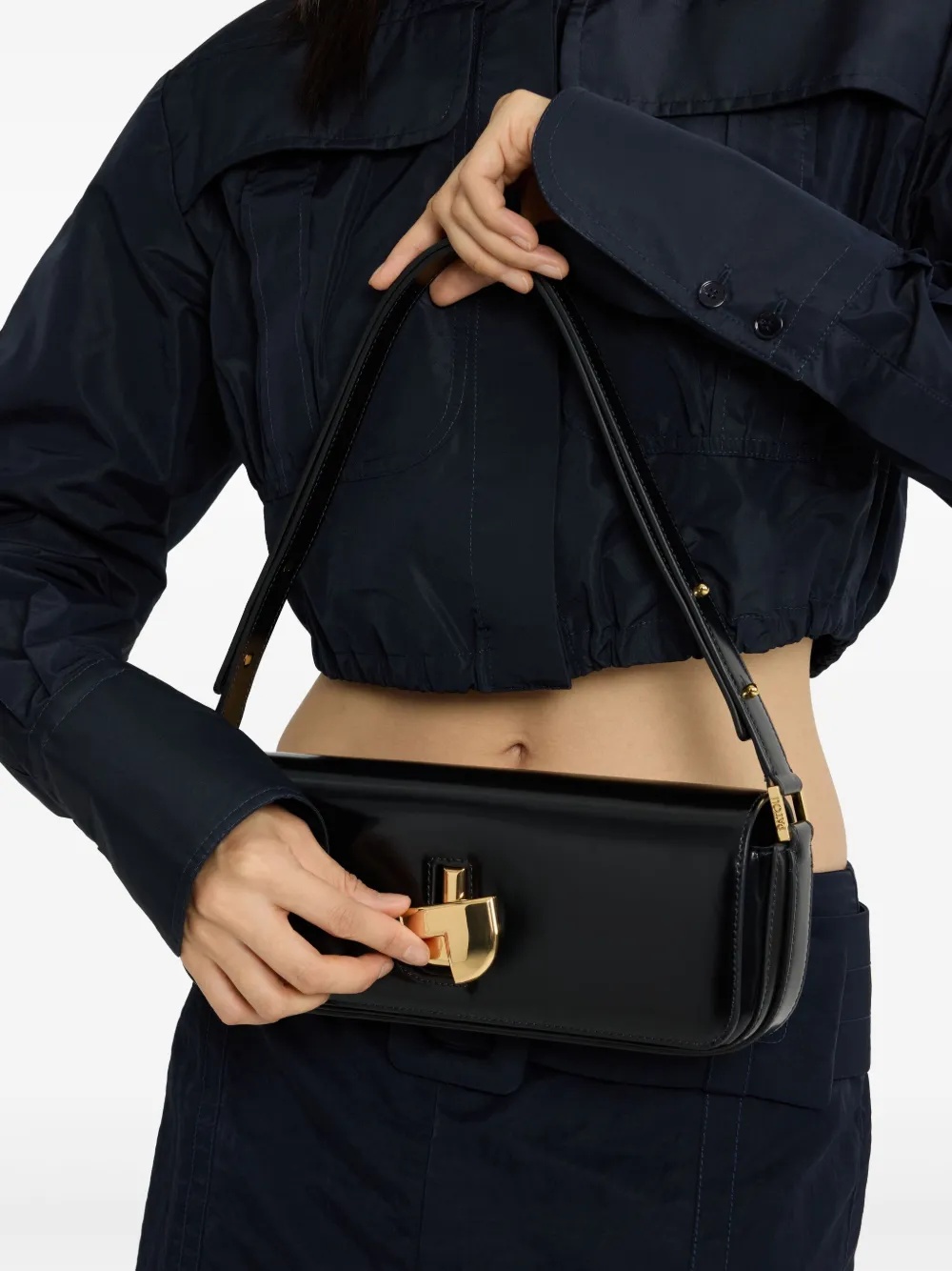 Patou Shoulder Bag With Structured Silhouette And Adjustable Strap In Black