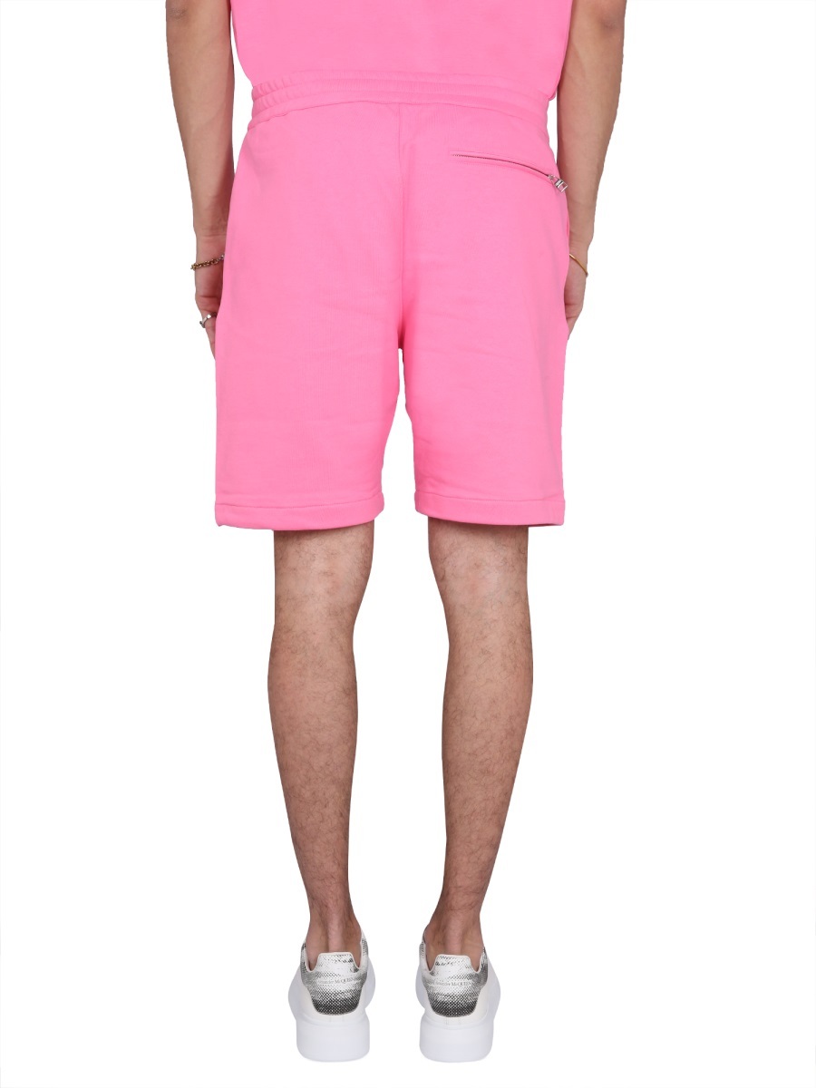 Alexander Mcqueen Men Bermuda Shorts With Graffiti Logo Print In Pink