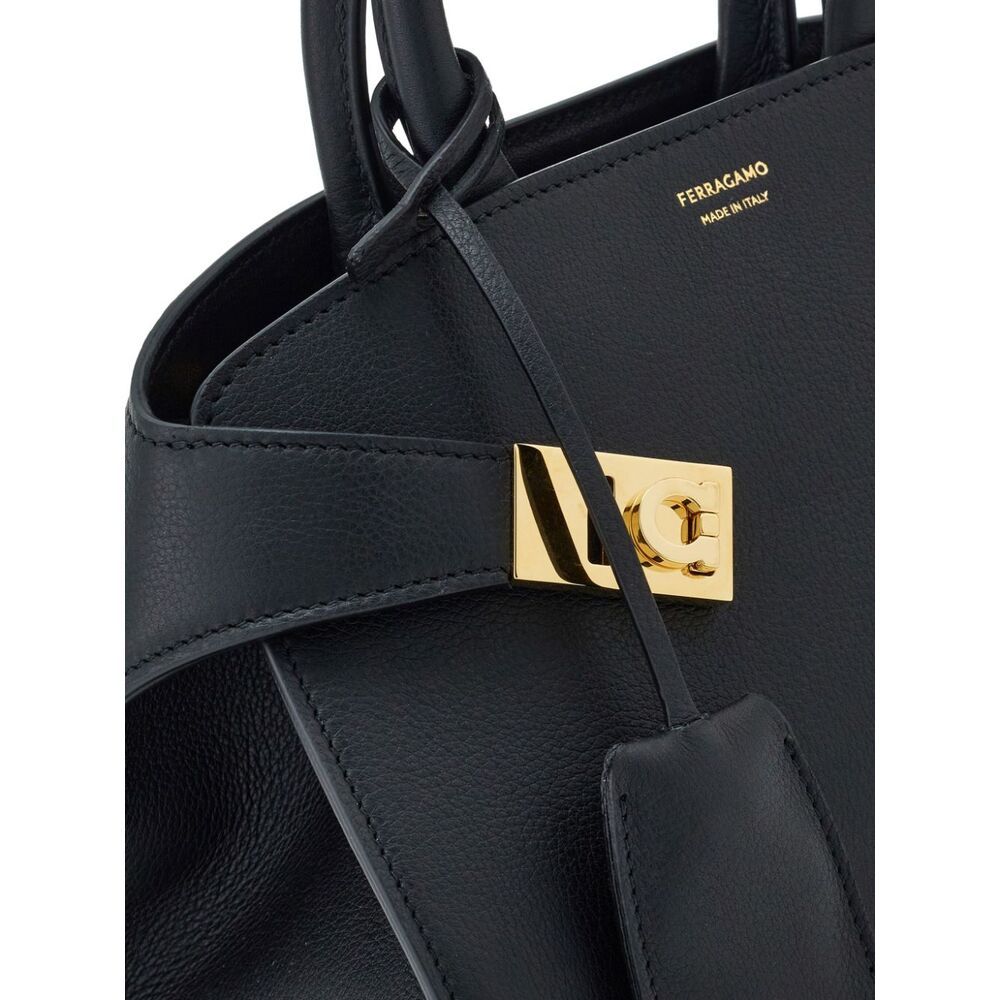 Shop Ferragamo Salvatore Mini Hug Top Handle Bag In Black