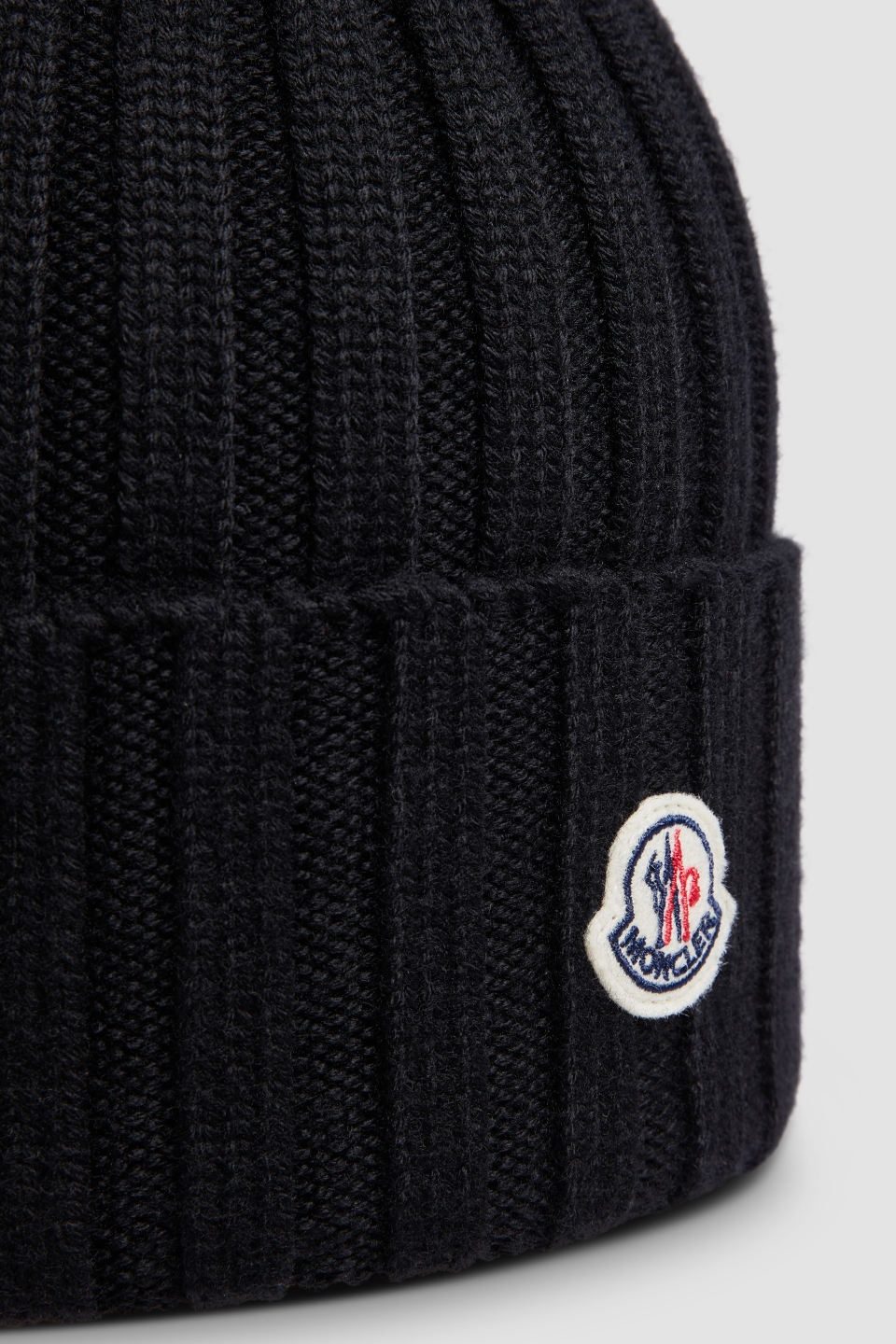 Moncler Ribbed Knit Wool Beanie With Faux Fur Pom-pom In Black