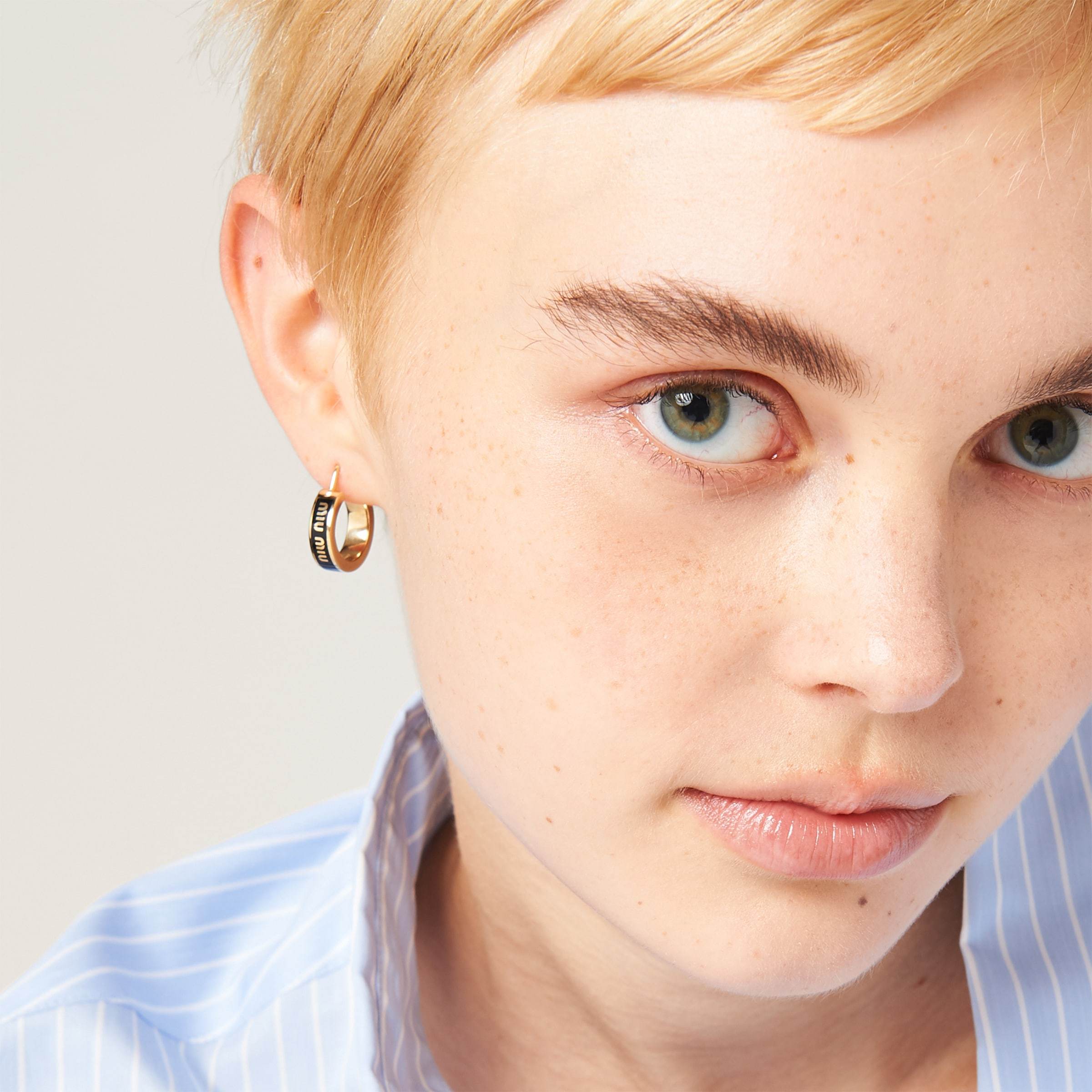 Shop Miu Miu Enameled Metal Earrings In Gold