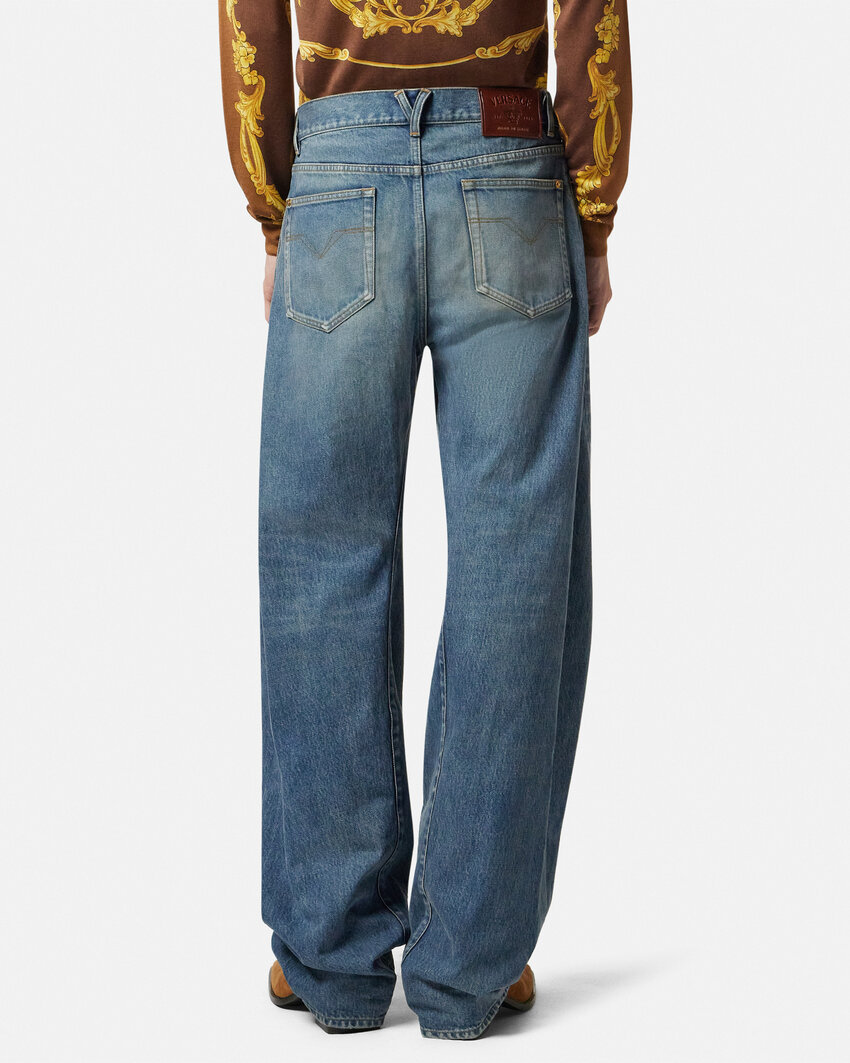 Versace Baggy Twisted Japanese Jeans In Blue