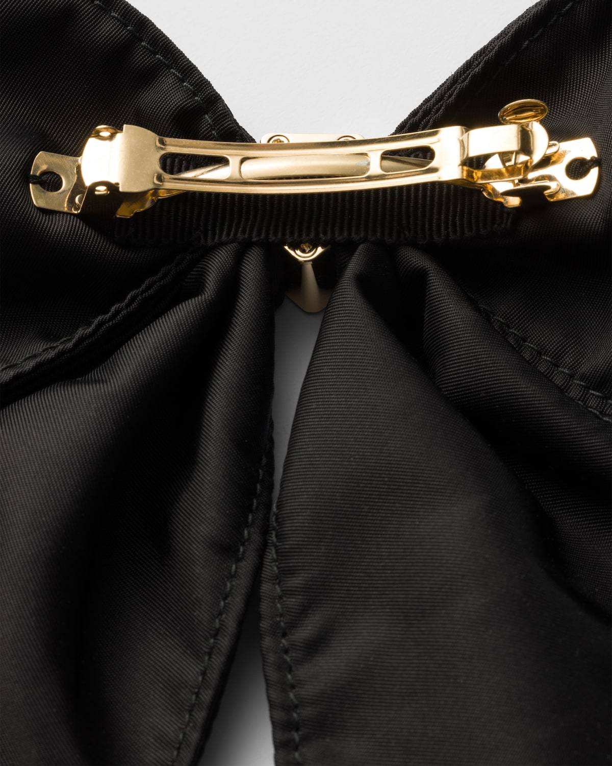 Prada Brass Hair Clip With Maxi Bow Design In Black