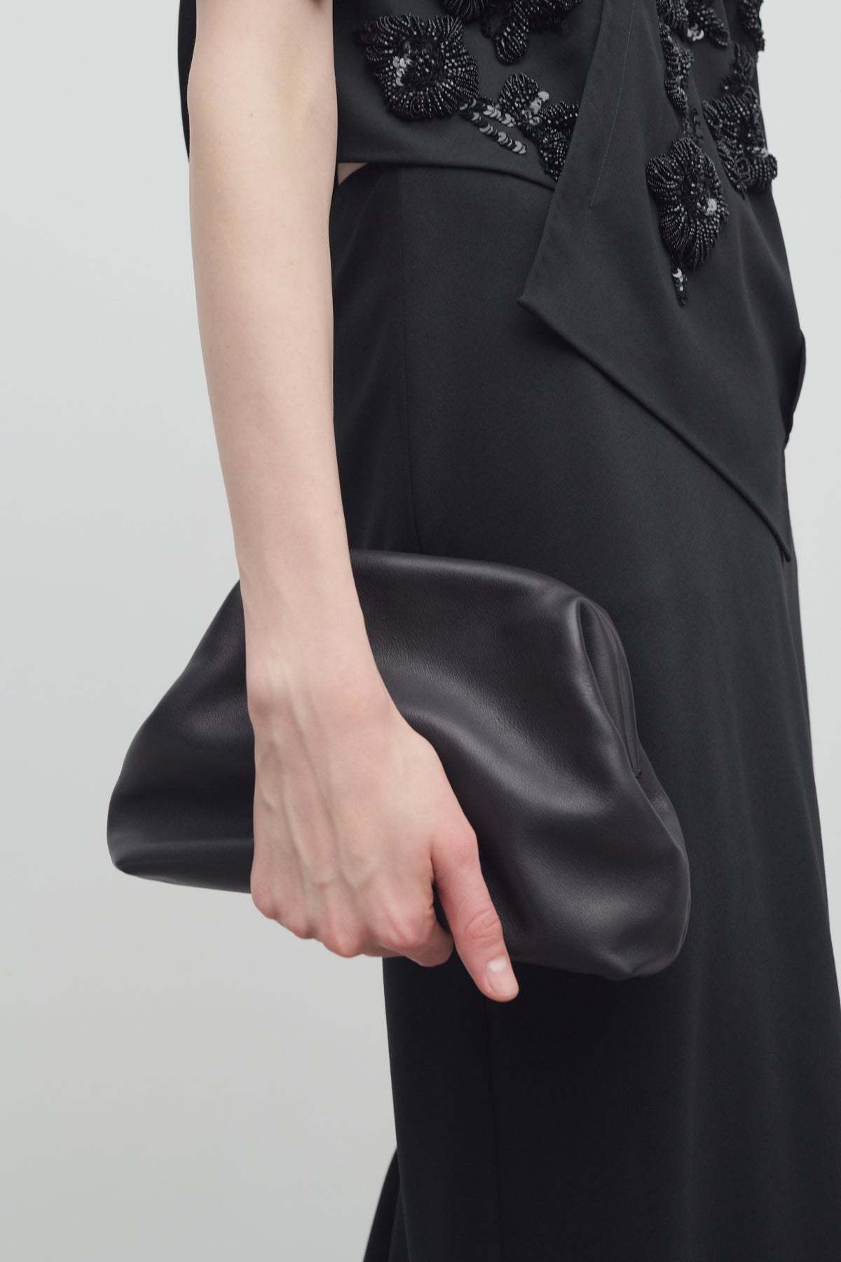 The Row Mira Clutch Bag In Saddle Leather In Black