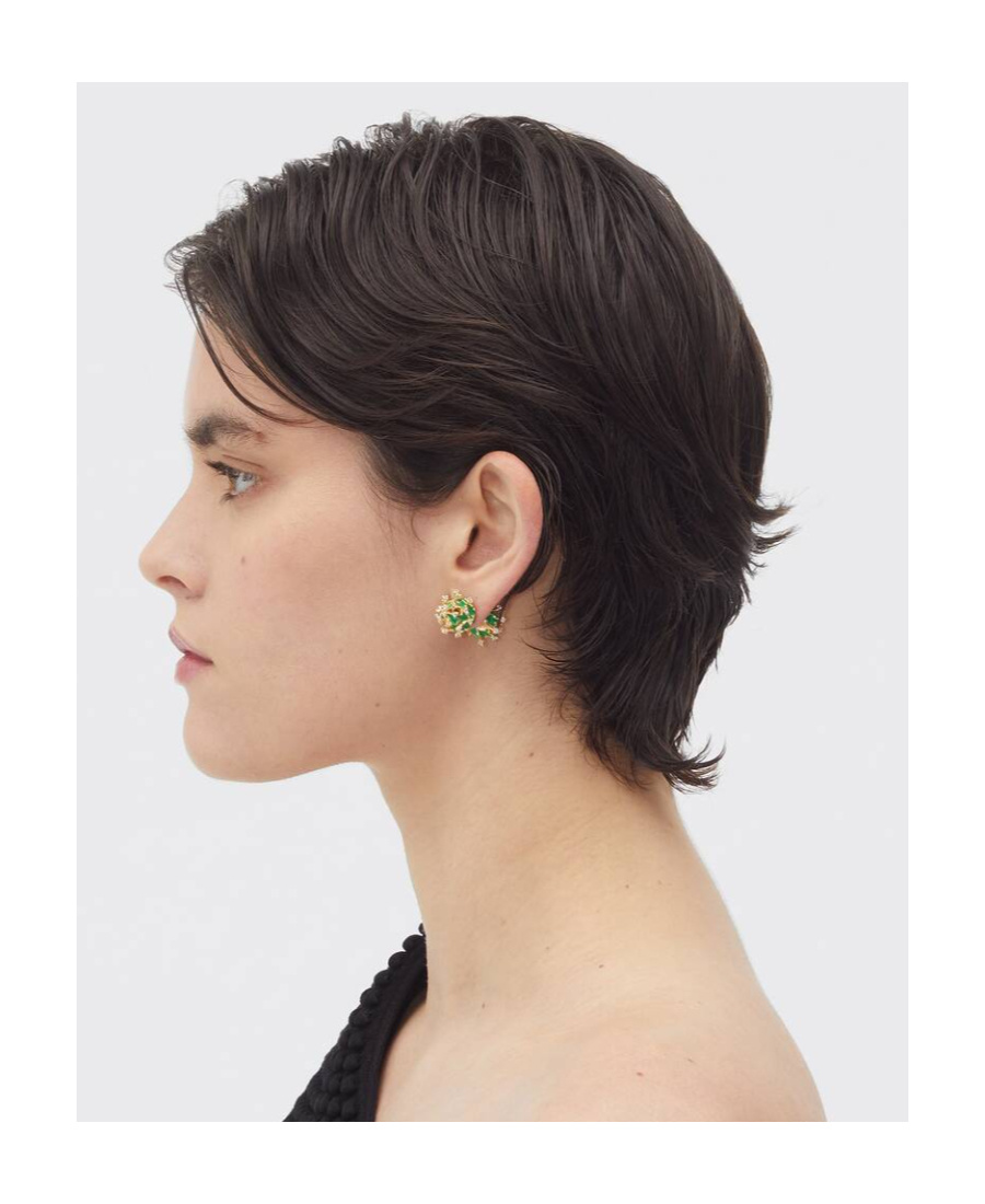 BOTTEGA VENETA WEARING EARRINGS ON TOP OF THE LOGO