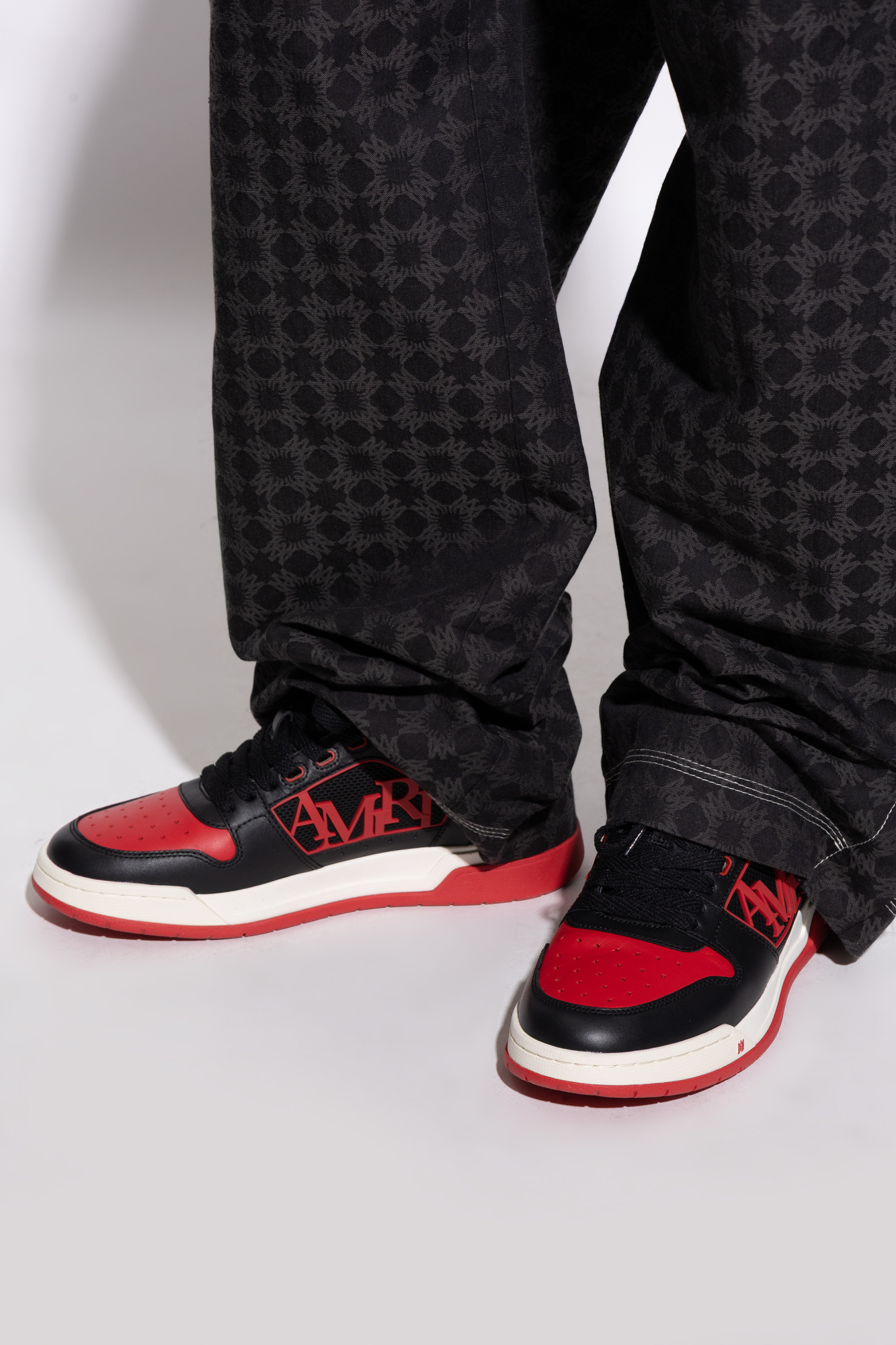 Amiri Low Top Sneakers With Round Toe And Perforated Patch In Black