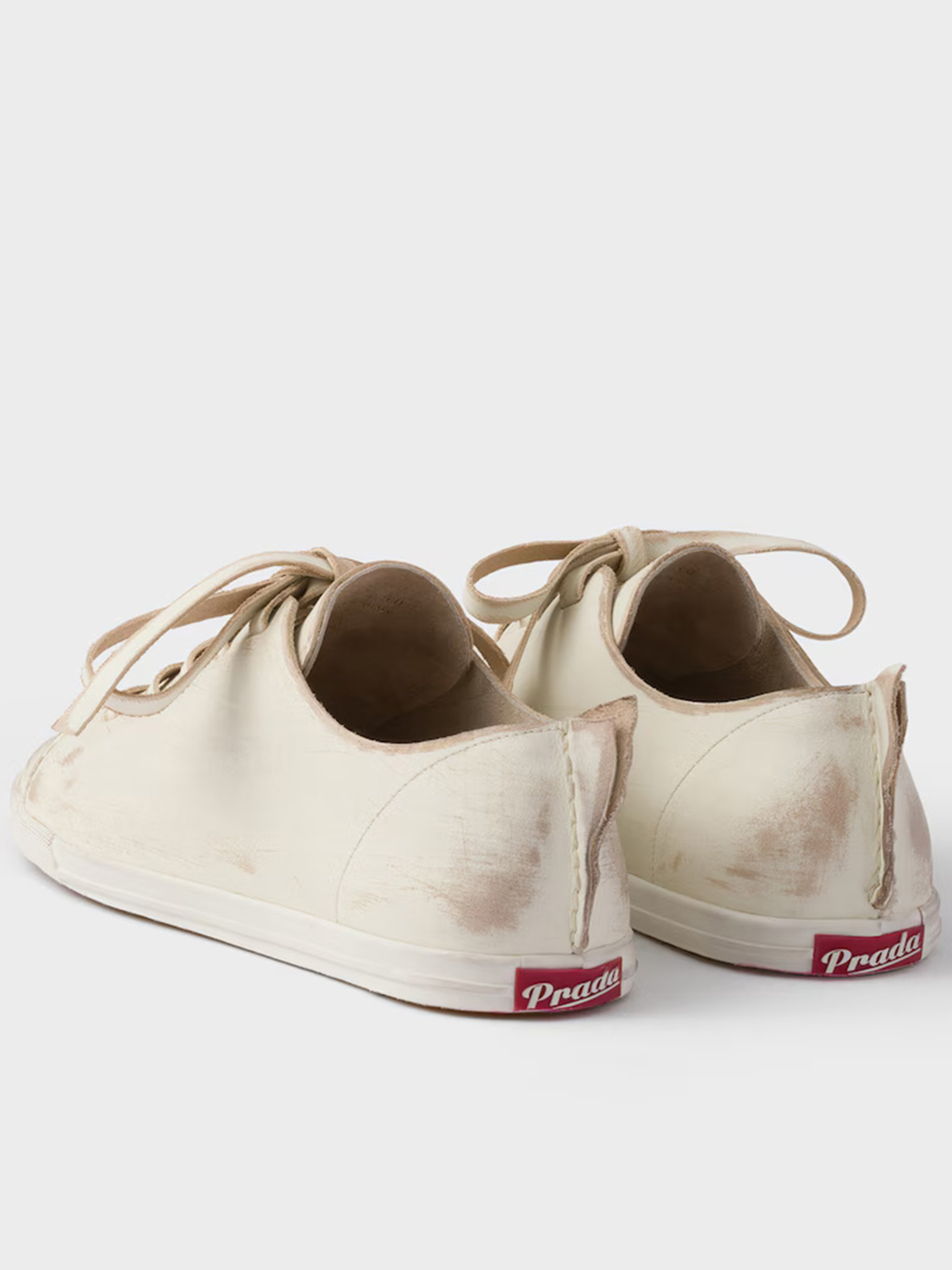 Prada Lace-up Distressed Low-top Sneakers In Neutral