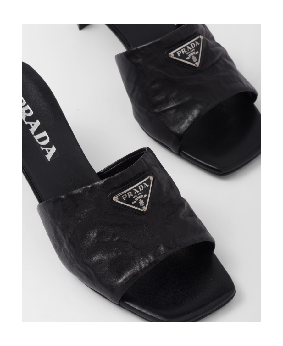 Prada Triangle Logo Quilted Mules In Black