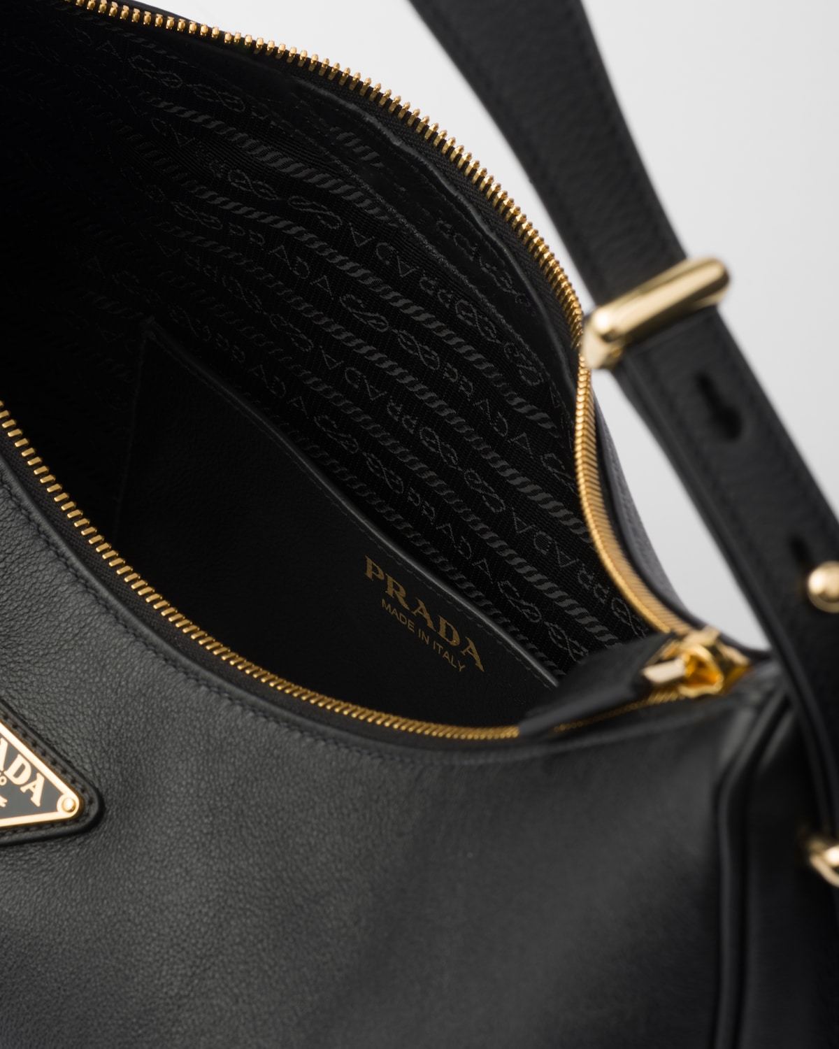 Prada Rounded Shoulder Bag With Gold-tone Hardware In Black
