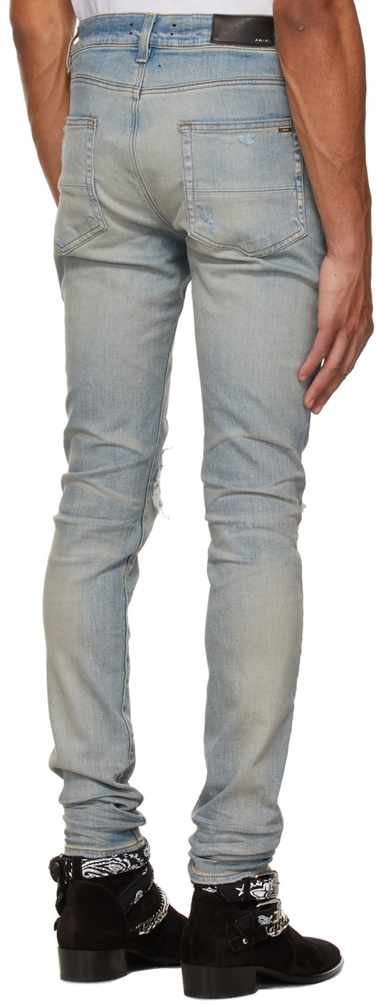 AMIRI MX1 RIPPED SKINNY JEANS