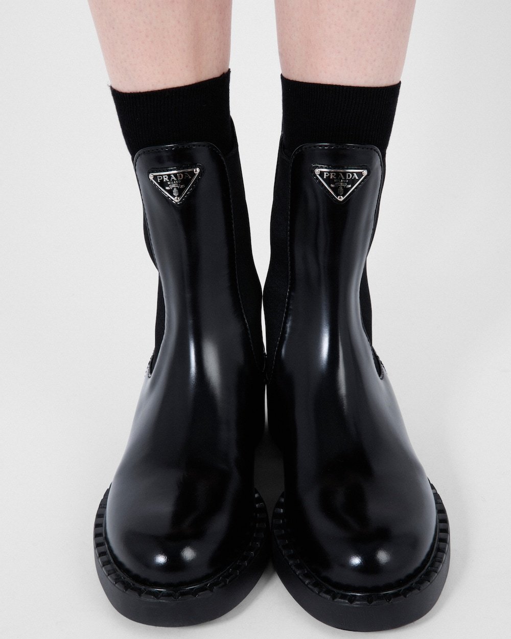 Prada Triangle-logo Chelsea Leather Boots In Black