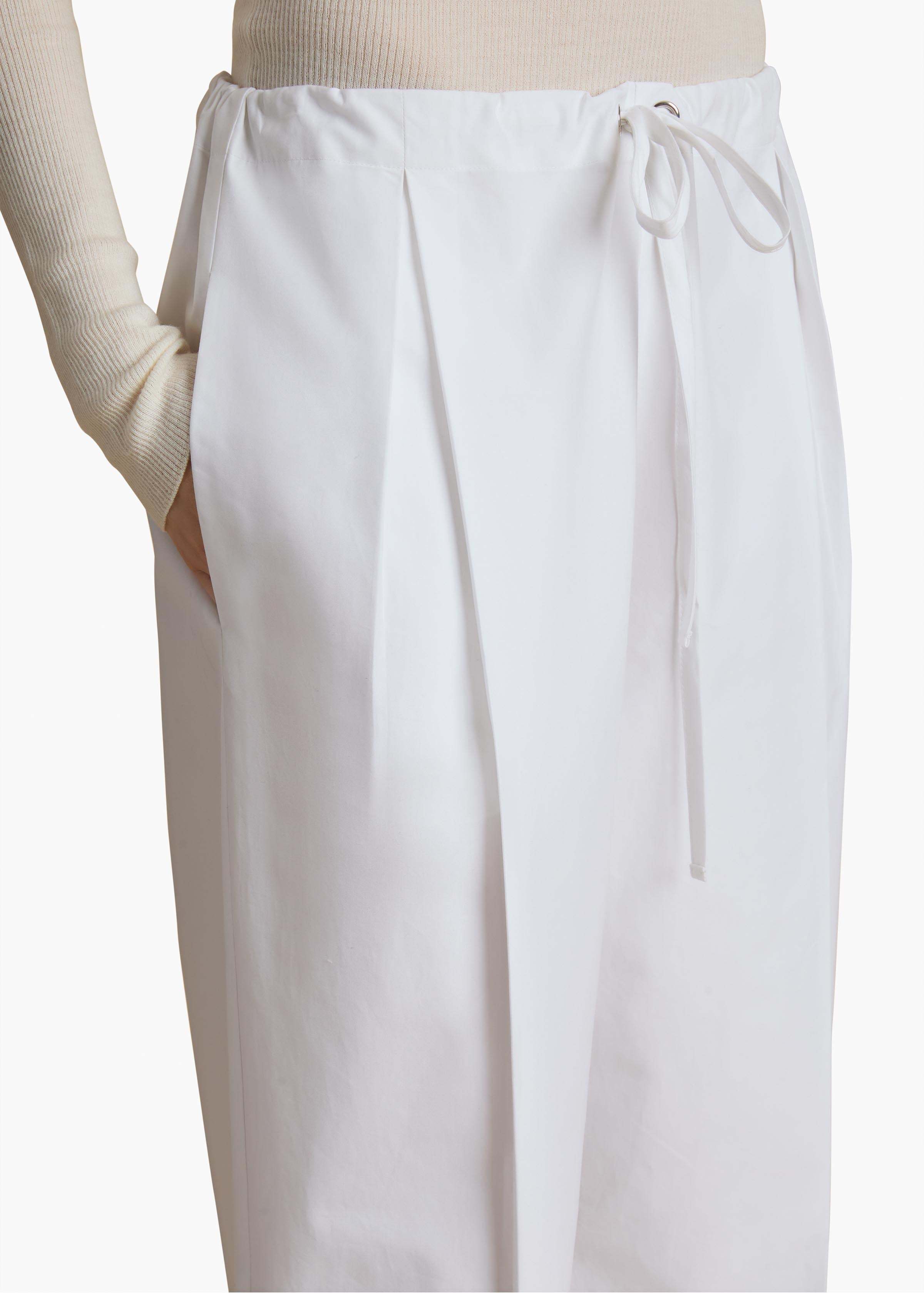 Shop Khaite Pressed Crease Drawstring Trousers In White