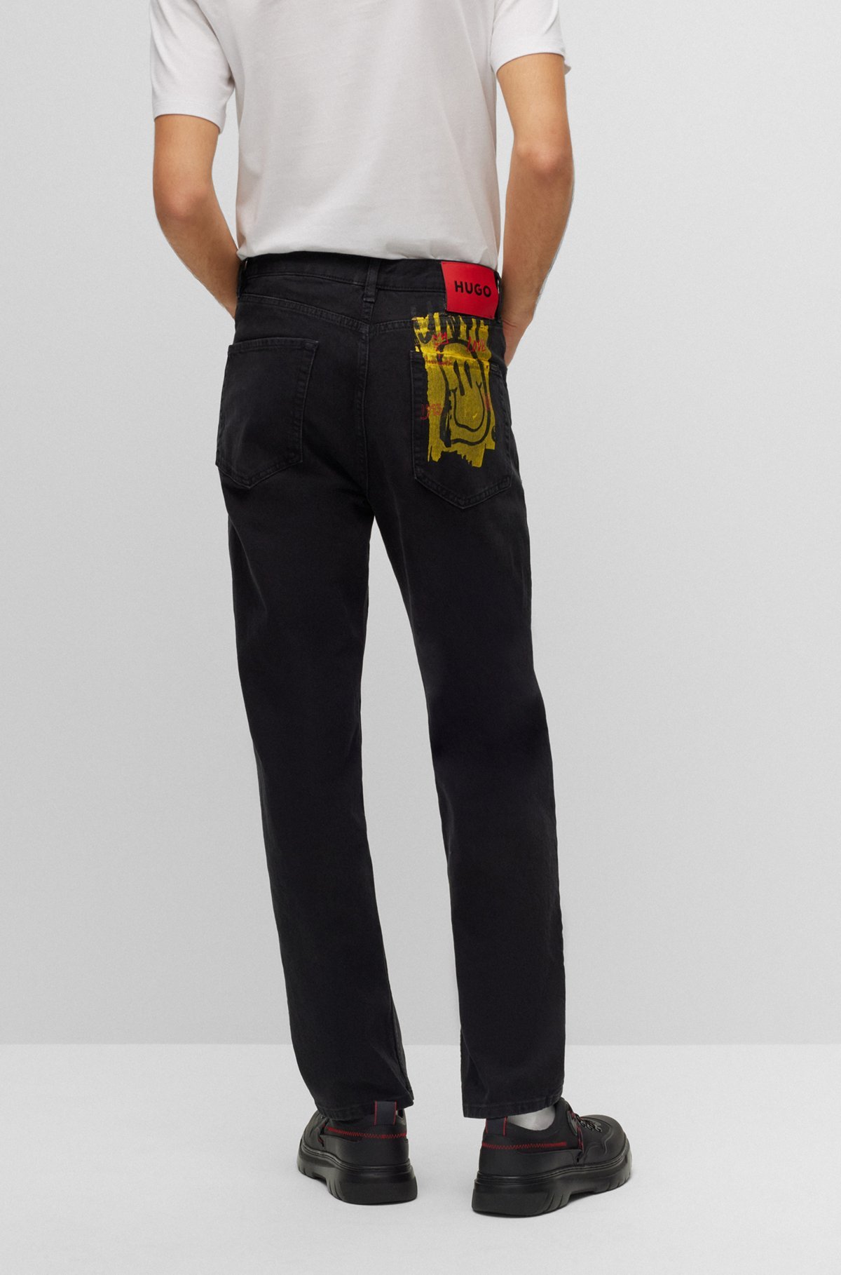 Hugo Boss Smiley-print Mid-rise Slim-fit Jeans In Black