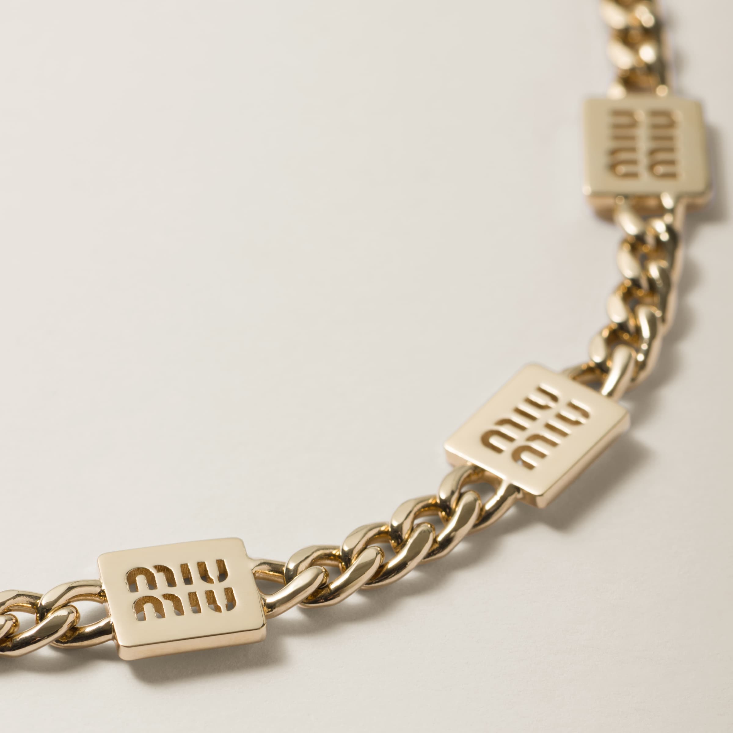 Miu Miu Logo Engraved Necklace In Yellow
