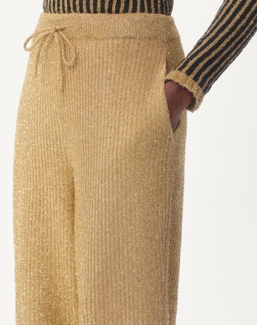 Shop Valentino Lurex Knit Trousers In Golden