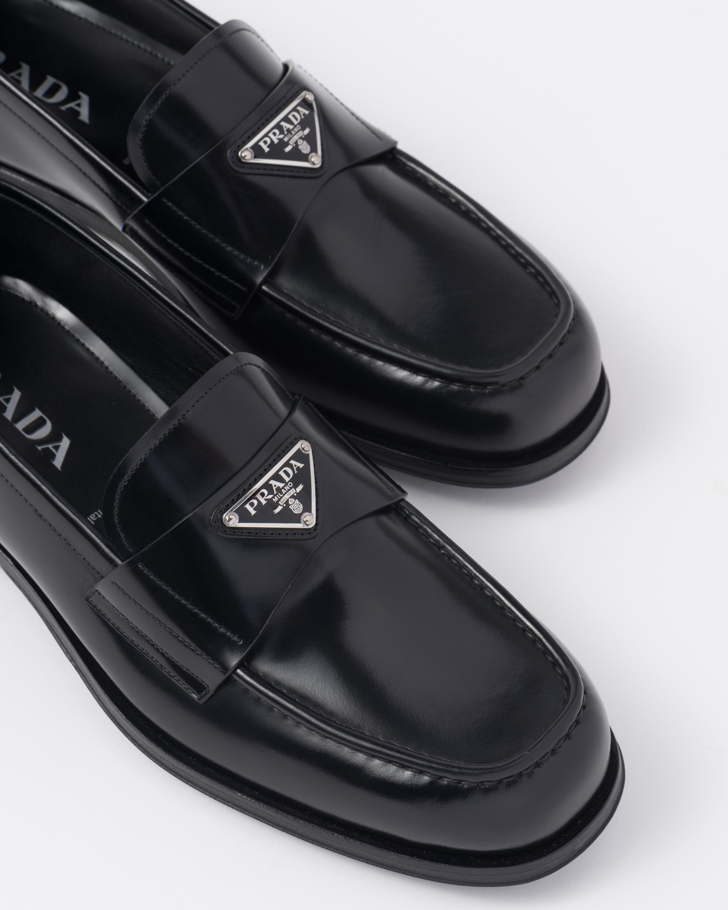 Prada Triangle Logo Chocolate Brushed Leather Loafers In Black