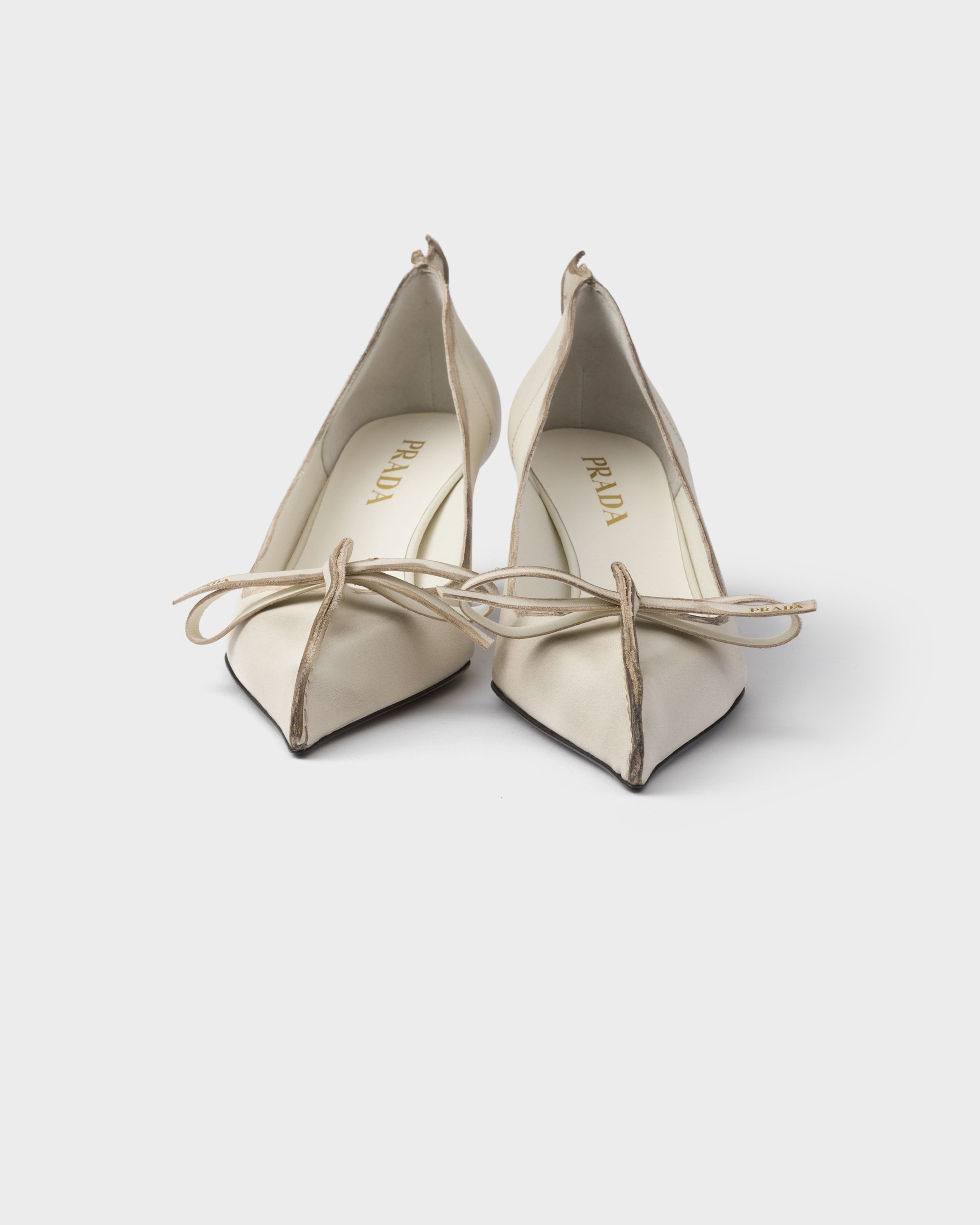 Prada Exposed Seam Kitten Heel Pump In Neutral