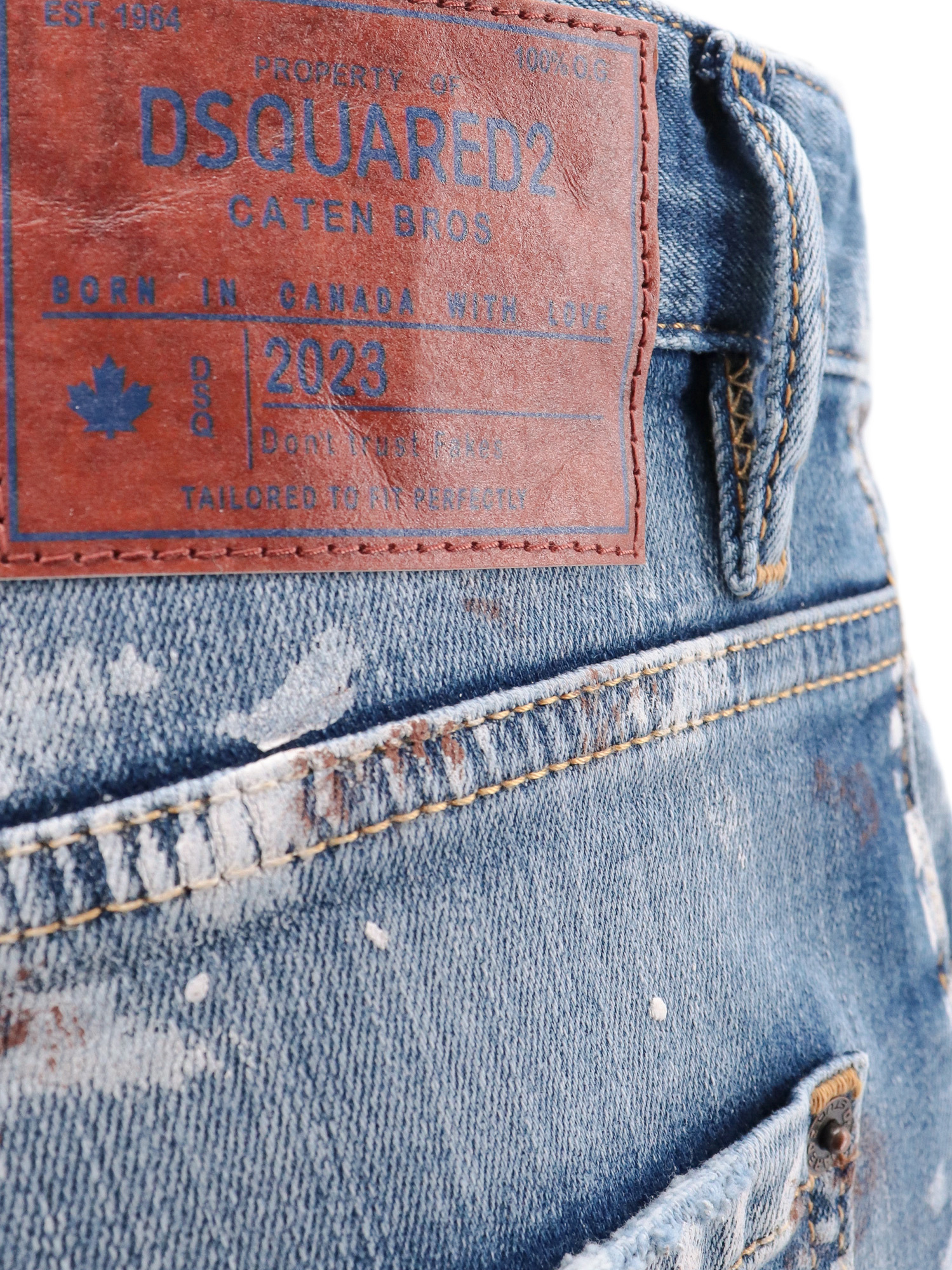 Shop Dsquared2 Paint Splattered Distressed Jeans In Blue